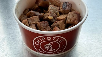 Chipotle unveiled its “first-ever high protein” menu on Dec. 23. One of the offerings is a snack-size cup of cubed steak that has 21 grams of protein and looks like what you'd feed a dog for its birthday.