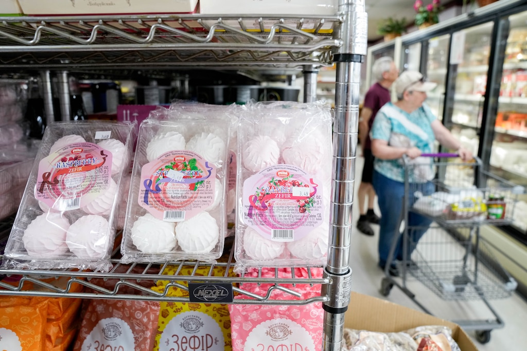 Zefir, similar to meringue, on a shelf as a couple walks through the frozen food aisle on the right at the International Food Market on Reisterstown Road in Baltimore, Md. on Saturday, July 5, 2025.