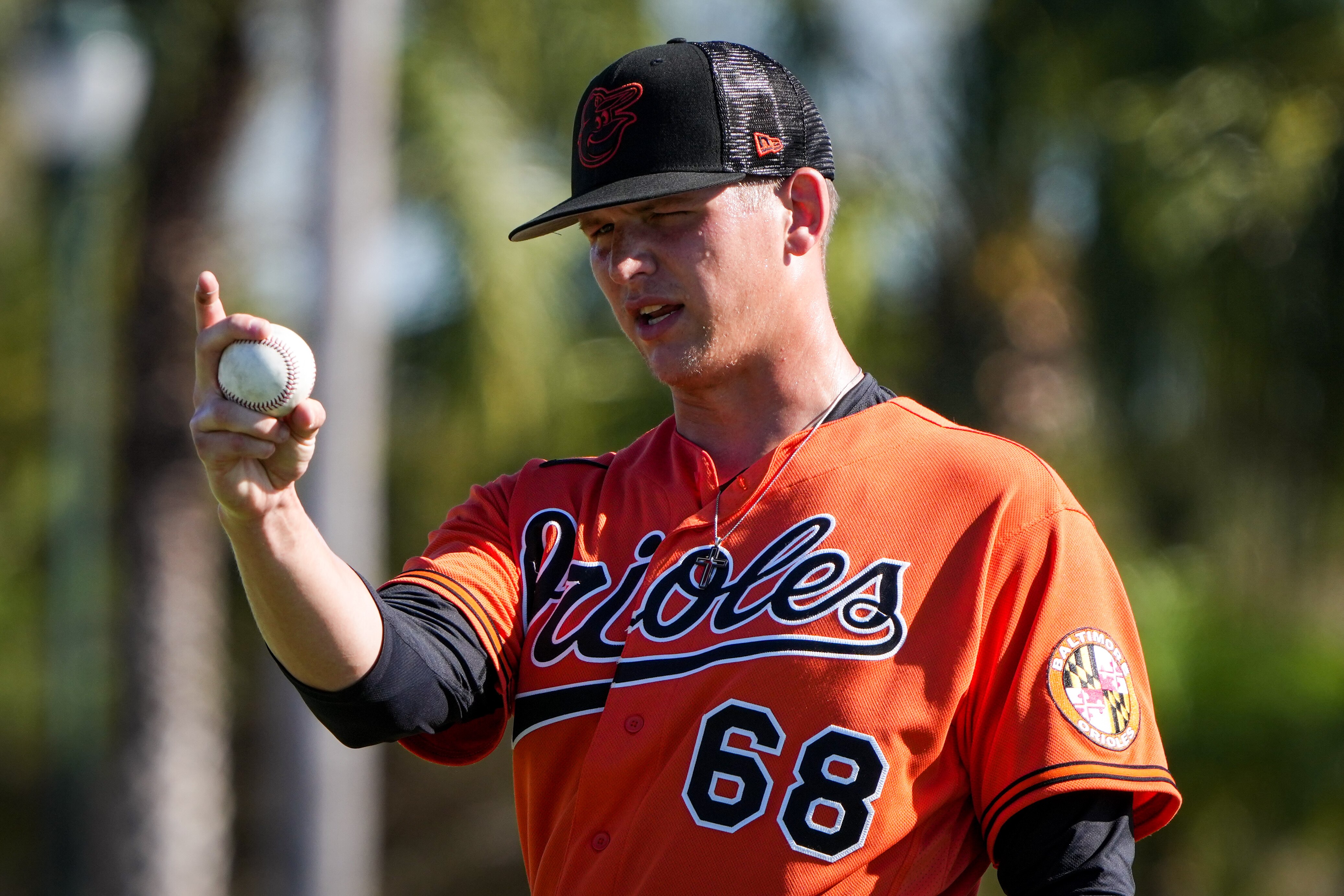 Tyler Wells (68) grips a baseball before throwing a pitch during workouts at Ed Smith Stadium in Sarasota on 2/22/23. The Baltimore Orioles’ Spring Training session runs from mid-February through the end of March.