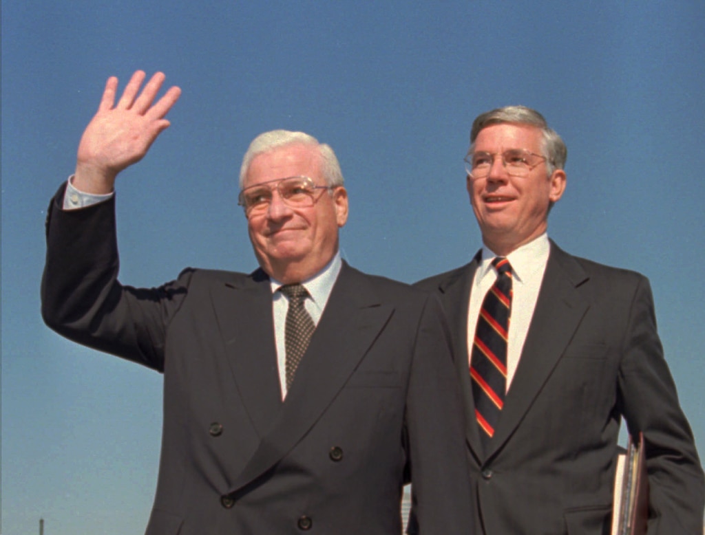 Cleveland Browns owner Art Modell waves to the crowd waiting to hear that the Browns will move to Baltimore as Maryland Gov. Parris Glendening looks on in Baltimore, Monday, Nov. 6, 1995.