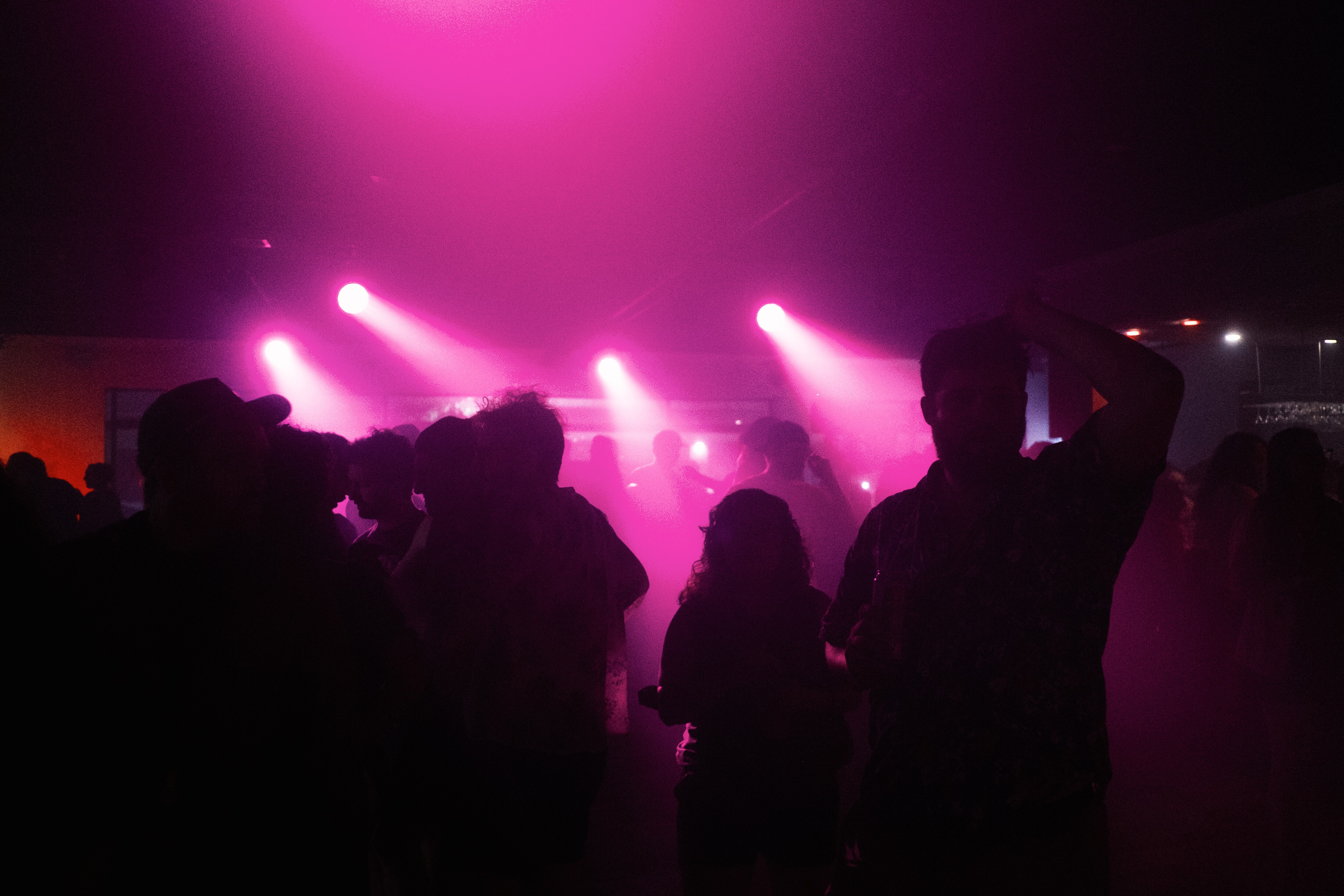 Attendees of Subscape gather in the air conditioned Pink Room at The Crown on August 3, 2024.