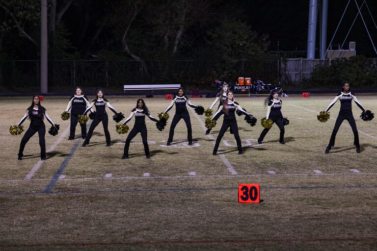 Members of the Poolesville Poms team perform during halftime of a football game on Friday, October 24, 2025 in Poolesville, MD.