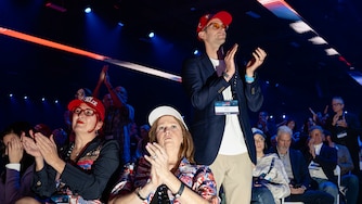 Attendees applaud during Turning Point USA's AmericaFest 2025, Saturday, Dec. 20, 2025, in Phoenix. (AP Photo/Jon Cherry)