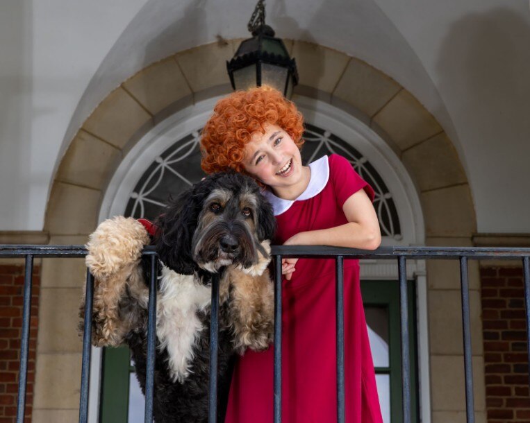 Jules Kanarek portrays Annie in the Compass Rose Theater production of “Annie” at Maryland Hall through Oct. 19.
Sequel plays Annie's dog Sandy, trained by Kelly Litchford of Leverage Animal Actors.