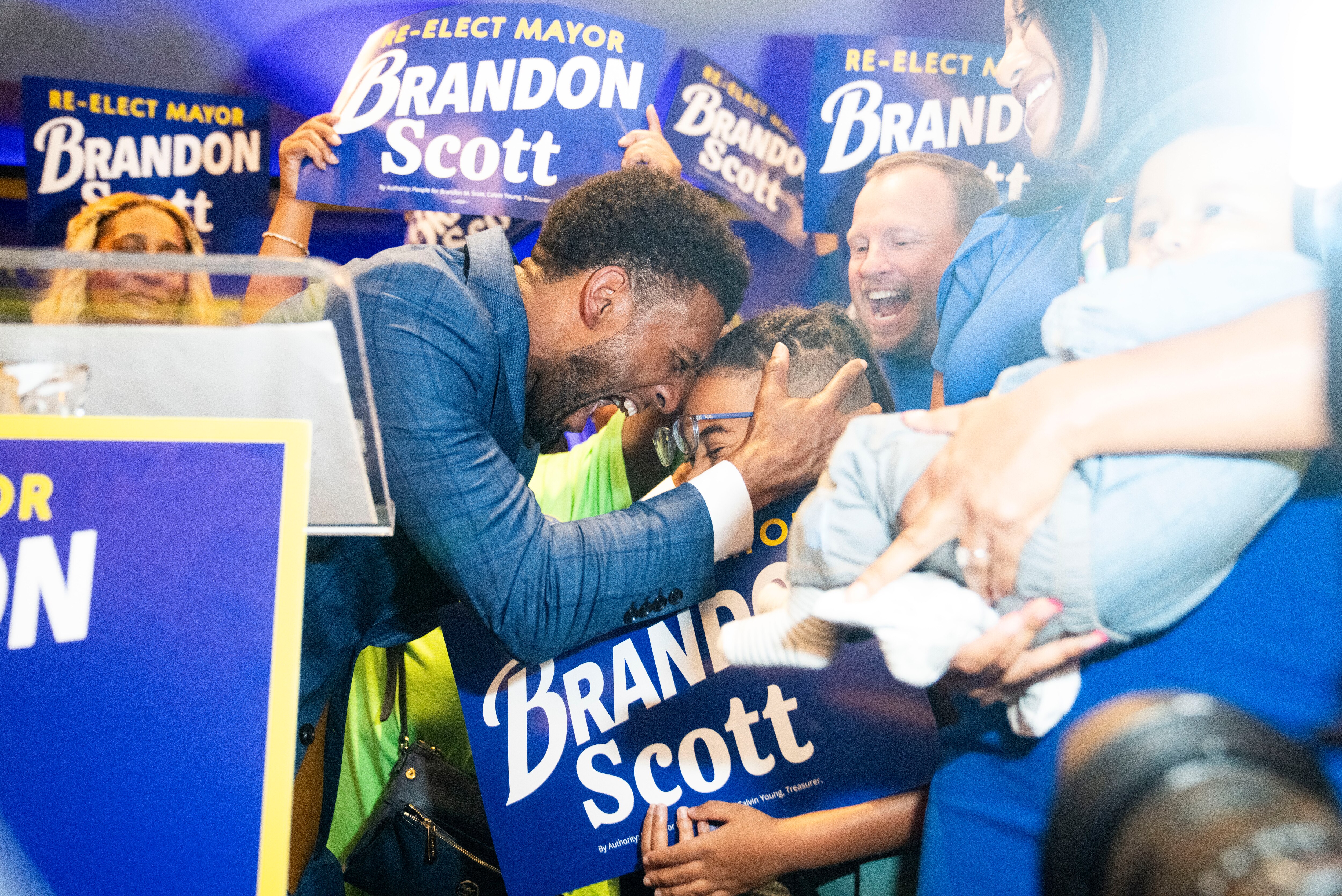 Mayor Brandon Scott celebrates with a young supporter after winning re-election, May 14,  2024.