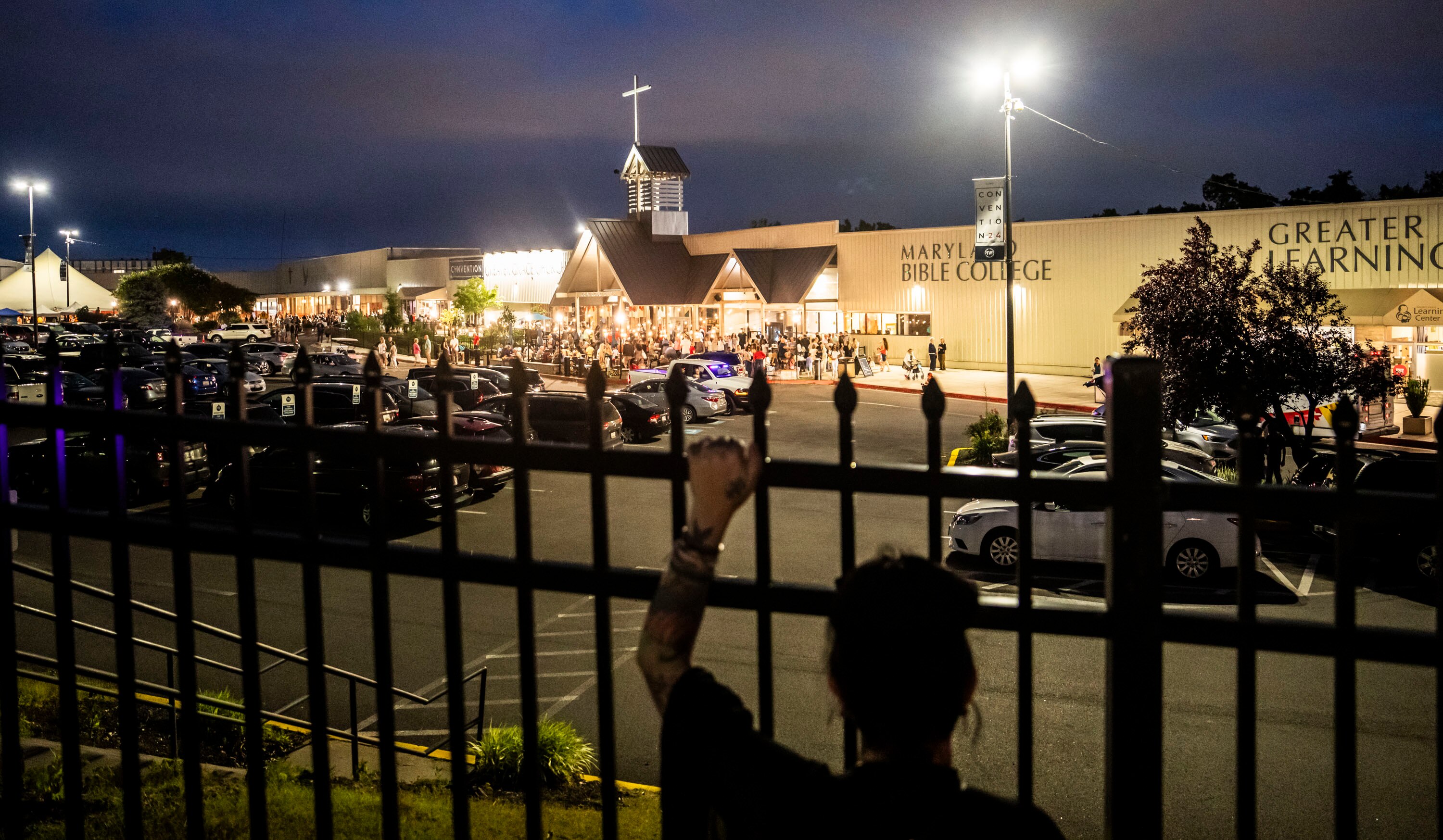 A woman who alleges she was assaulted by a Greater Grace pastor as a child protests outside the church in 2024 alongside relatives, friends and supporters.