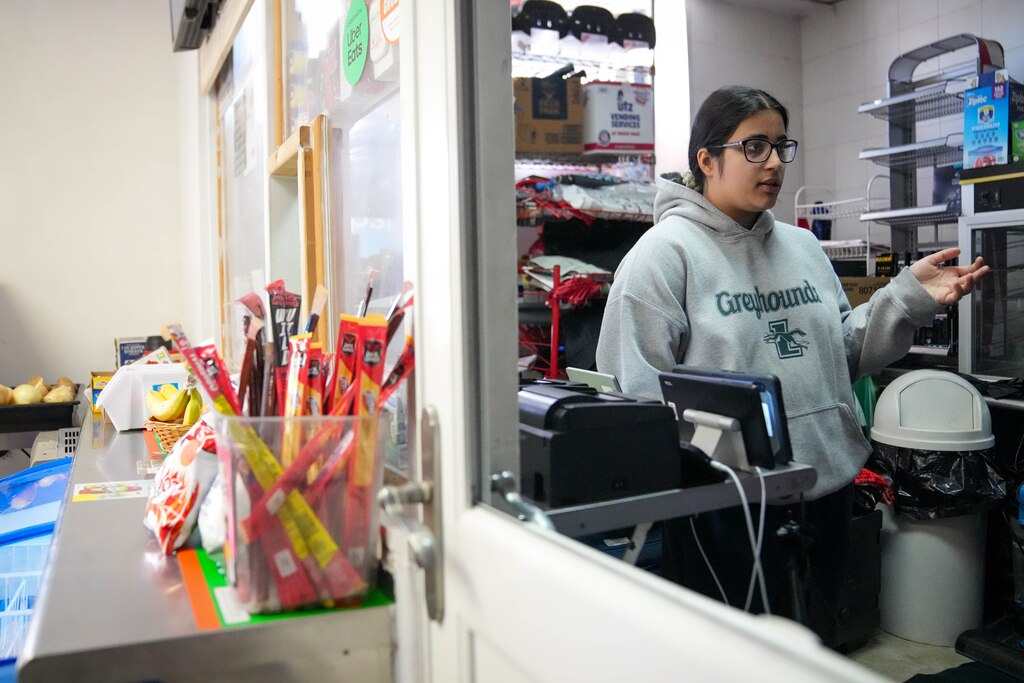 Raman Johal, 19, the food manager at India Tandoor, is interviewed inside her family’s shop in Baltimore, Md. on Wednesday, March 19, 2025. The small Indian restaurant is located in the back of a convenience store in Baltimore’s Remington neighborhood.