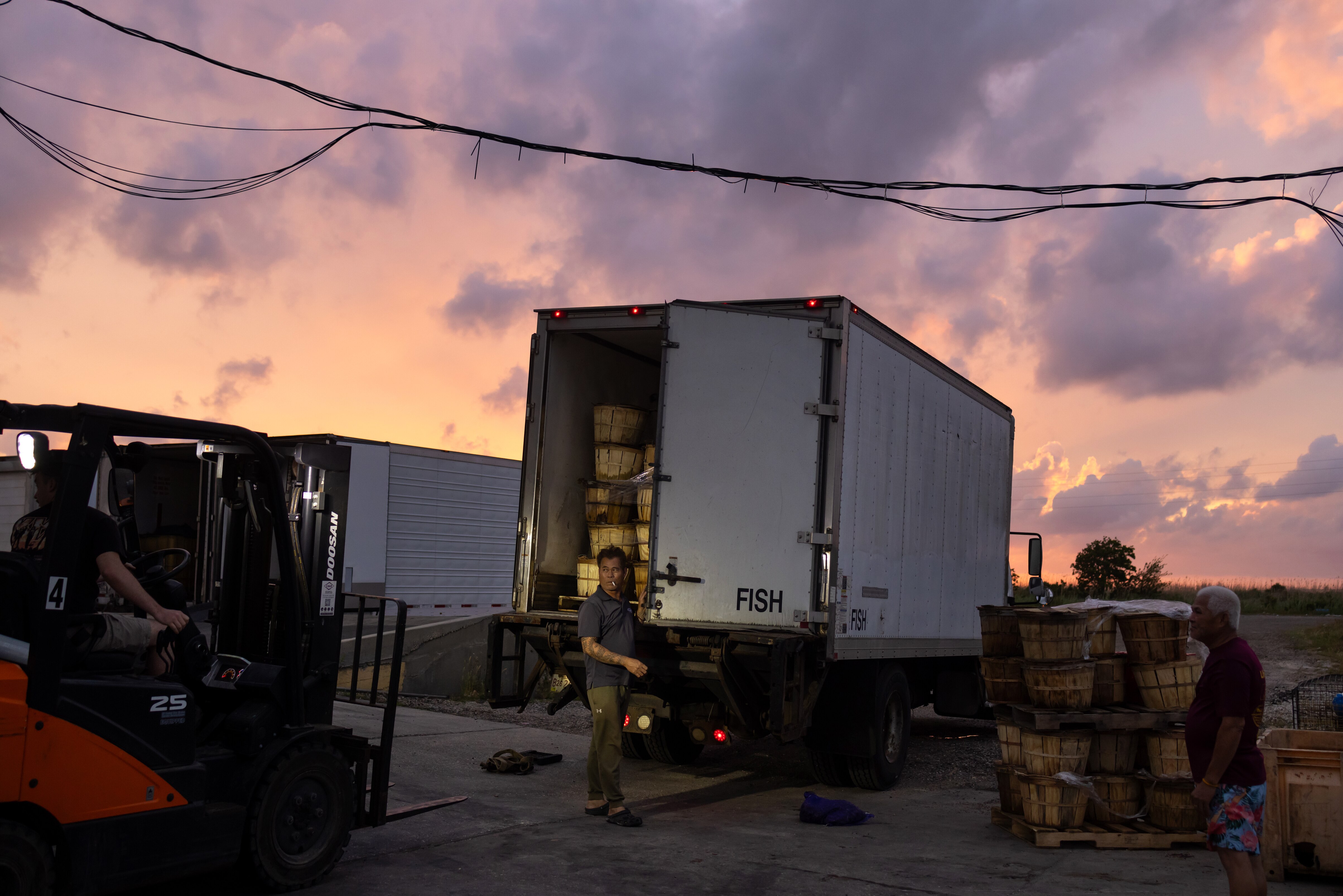 Rin Tho loads a truck filled with crabs that is headed to the Pomes picking plant in Alabama at Pomes Seafood facility in New Orleans. Pomes started running his own trucks to Baltimore in 2017 and now delivers about 8,000 bushels of live crabs weekly to Maryland markets.