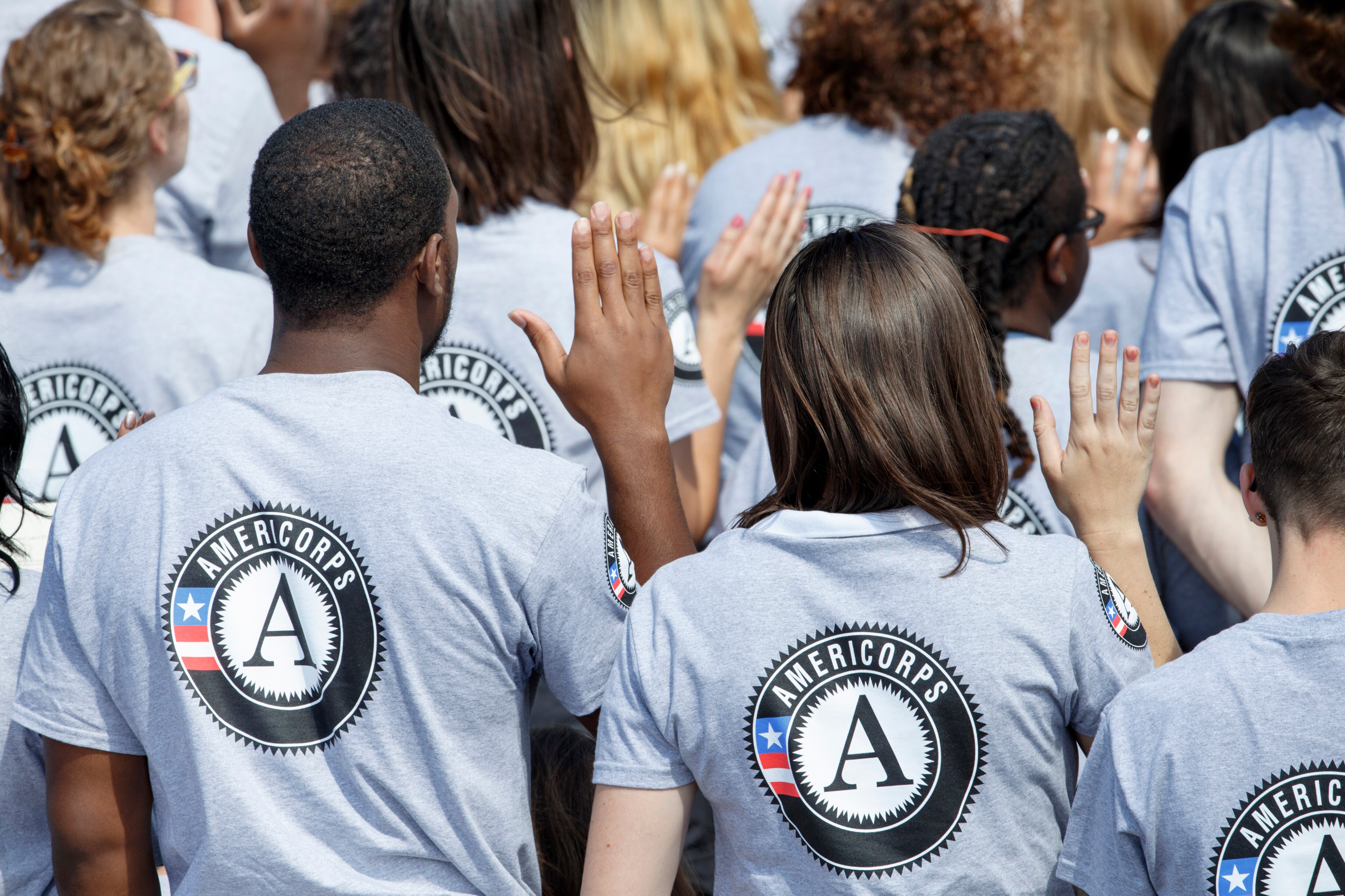 FILE - As President Barack Obama and former President Bill Clinton mark the 20th anniversary of the AmeriCorps national service program, hundreds of new volunteers are sworn in for duty at a ceremony, Friday, Sept. 12, 2014, on the South Lawn of the White House in Washington. (AP Photo/J. Scott Applewhite, file)