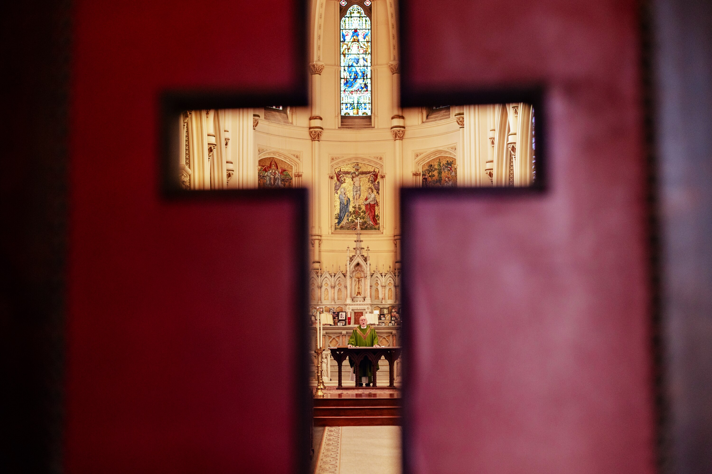 The Rev. Martin Demek prepares for the second-to-last Sunday mass at the Corpus Christi church in Baltimore on Nov. 17.