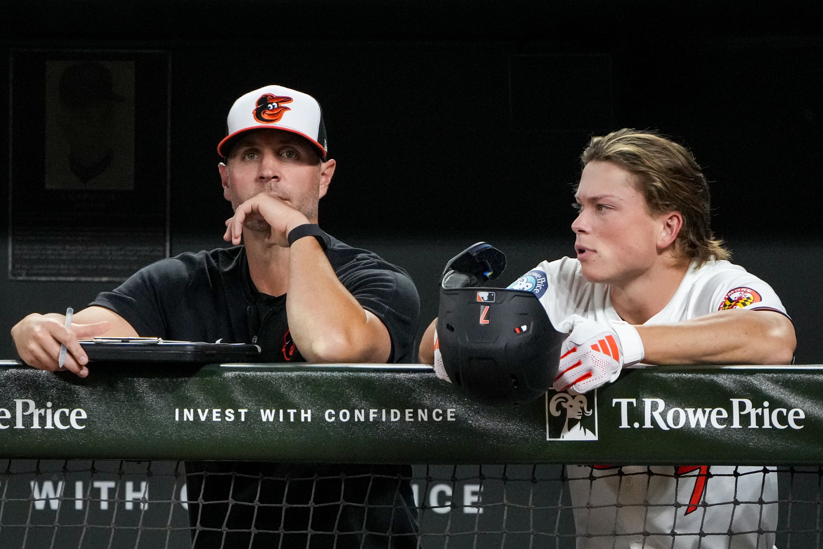 Baltimore Orioles hitting coach Matt Borgschulte and second baseman Jackson Holliday (7) watch from the dugout as another Oriole prepares for their at-bat against the Chicago White Sox at Camden Yards in Baltimore on September 4, 2024.