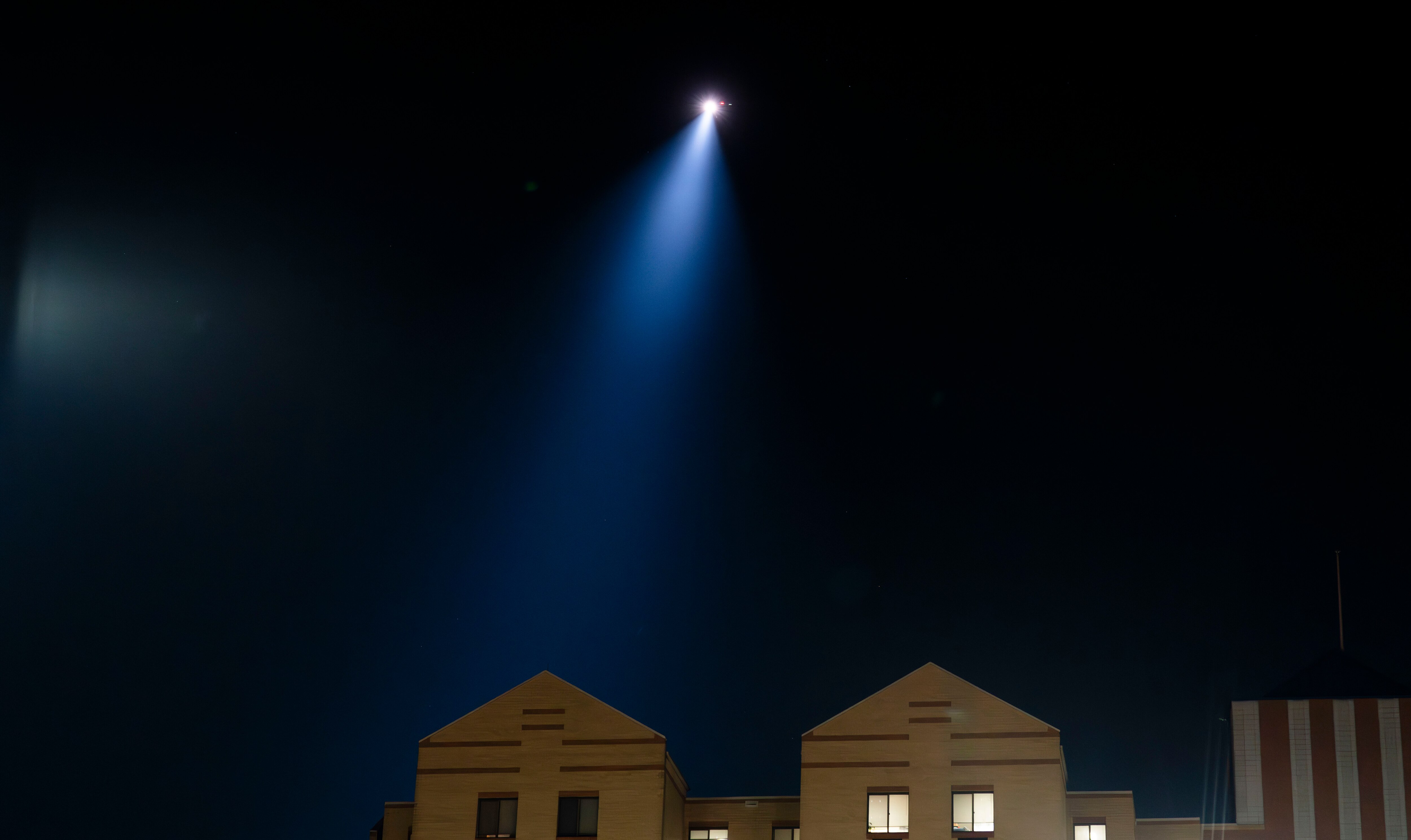 A helicopter searches the campus of Morgan State, where there was a shooting on Oct. 3, 2023.