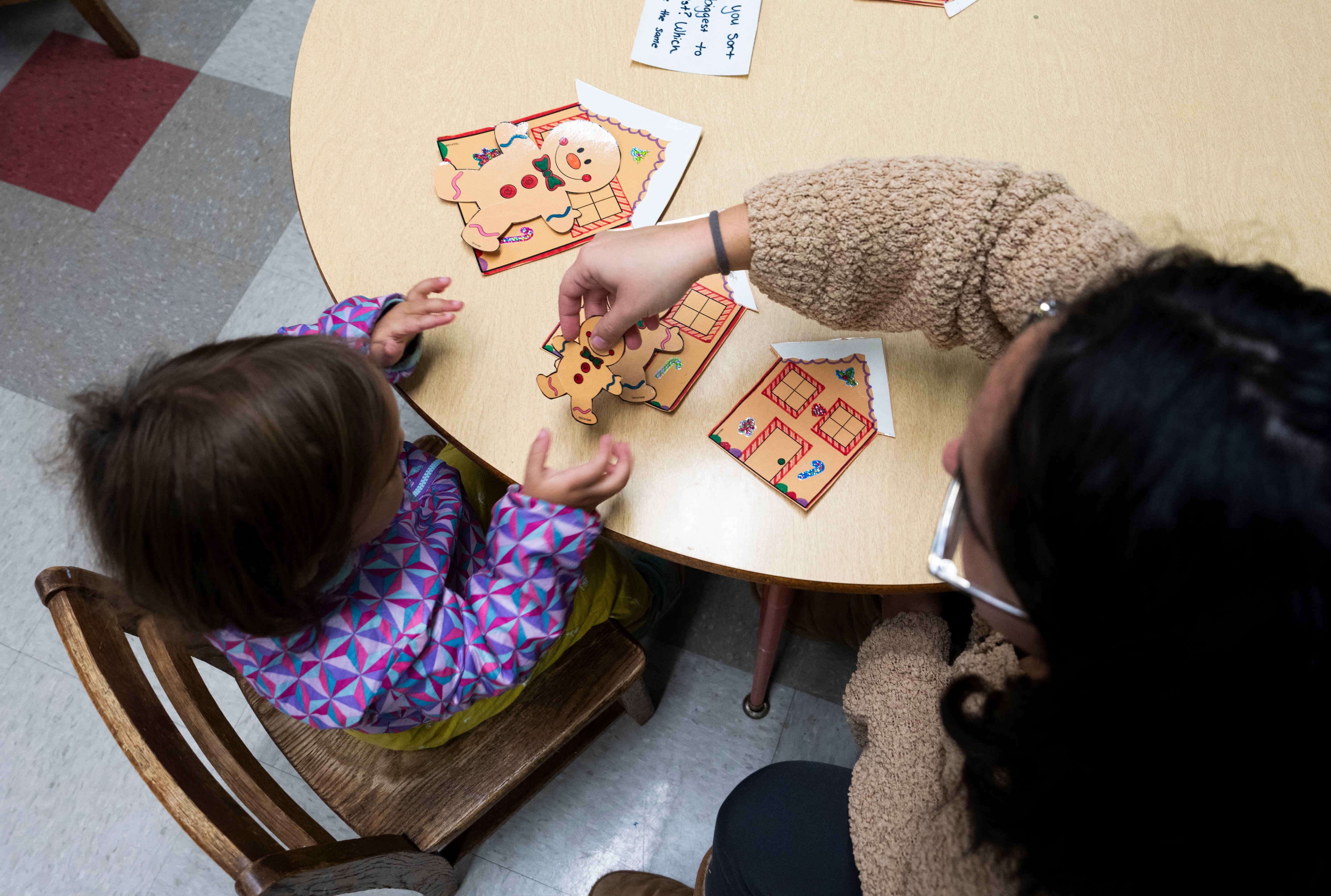 Deanna Patterson helps daughter Ellis with arts and crafts. Catonsville Cooperative Preschool is unique in that parents have a present and hands-on educational experience with their children during the school day.