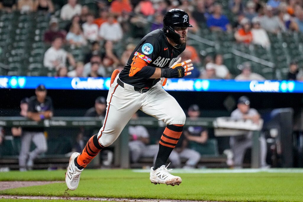 Baltimore Orioles outfielder Colton Cowser (17) runs to first base after connecting with a pitch in the 9th inning of a game against the Colorado Rockies at Oriole Park at Camden Yards in Baltimore, Md. on Friday, July 25, 2025.