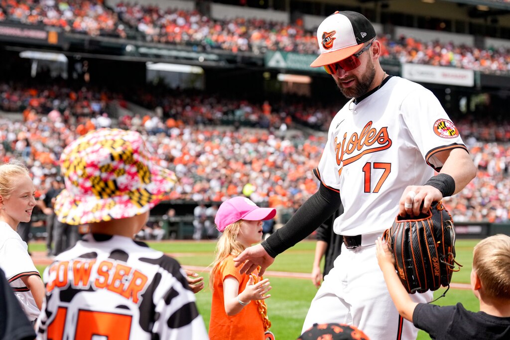 Baltimore Orioles outfielder Colton Cowser (17) high fives young fans before the third game of a series against the Detroit Tigers at Camden Yards in Baltimore on Sunday, September 22, 2024.