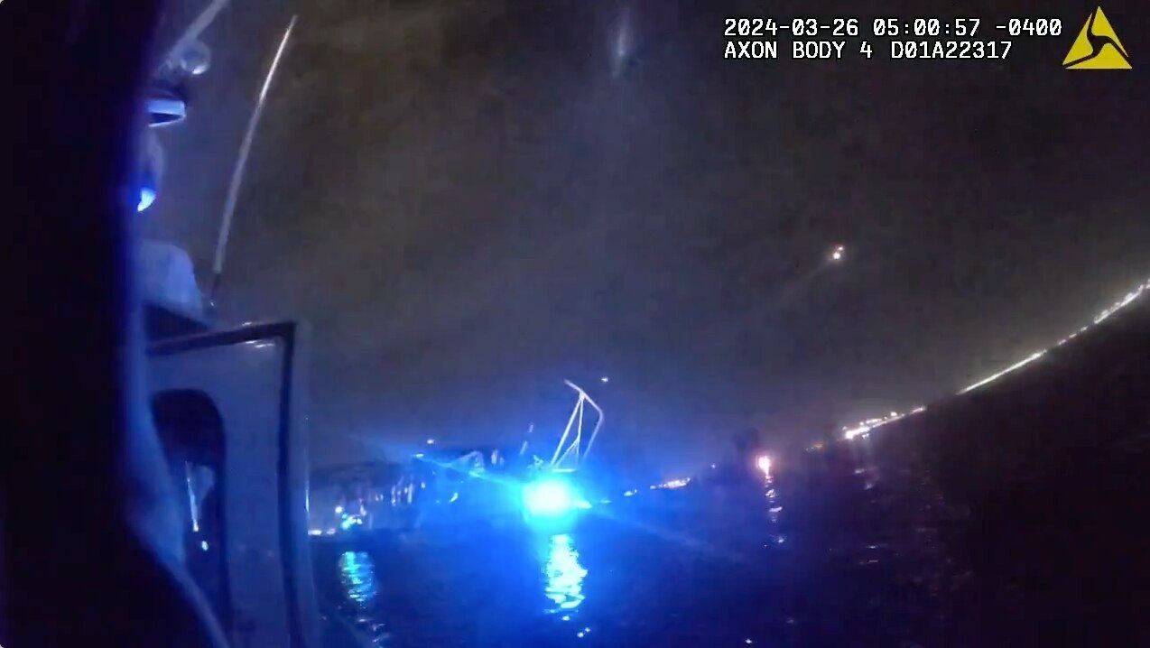 A screenshot from body camera footage by the Maryland Natural Resources Police of the Francis Scott Key Bridge collapse site on the Patapsco River in the early morning hours. The screenshot indicates the video was taken at just past 5 a.m. on March 26, 2024.