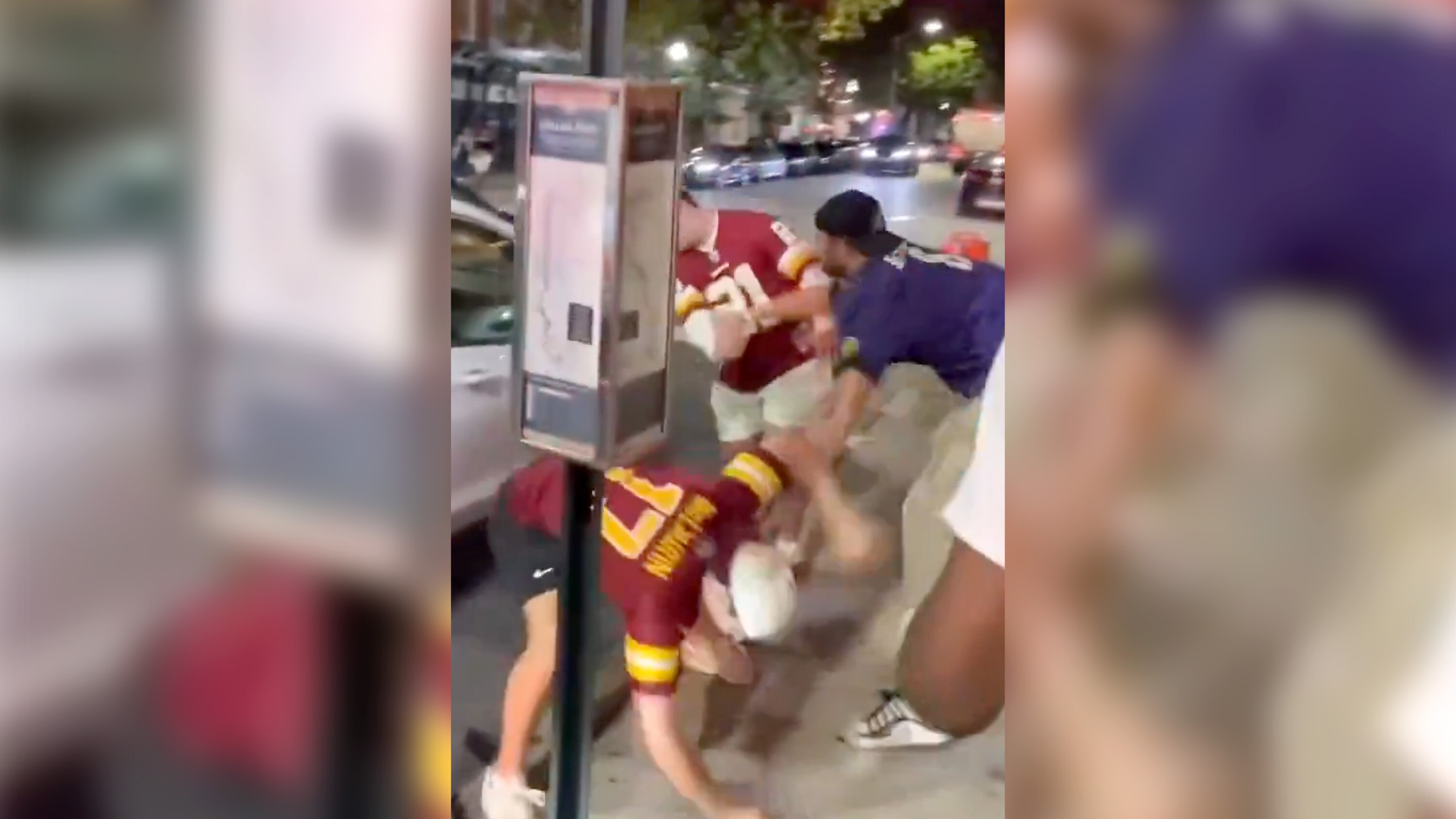 A still from a video posted on Instagram showing a fight between Ravens and Commanders fans earlier this month.