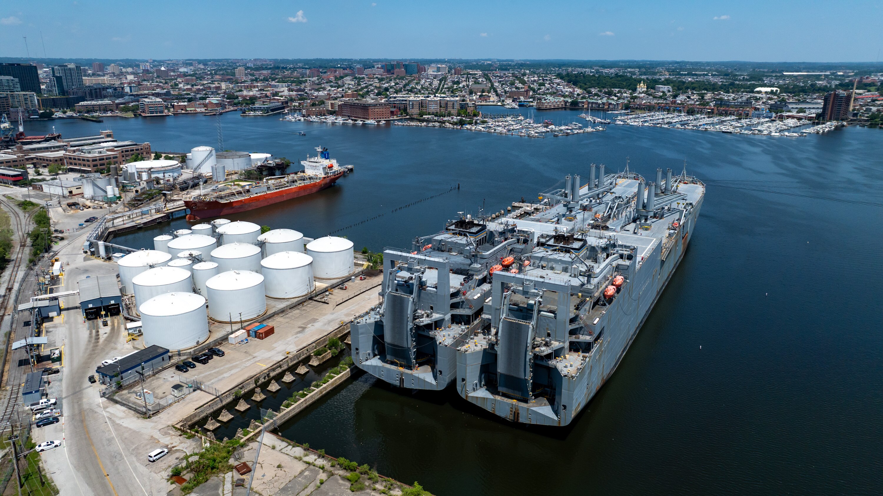 A pair of huge Navy ships, the USNS Charlton, left, and the USNS Pomeroy, docked near residential homes at North Locust Point on June 5. Since then, residents say that the ships have never turned off the engines -- meaning that they are always making tons of noise, shining bright lights into people's windows, and making the air all smelly with diesel.
