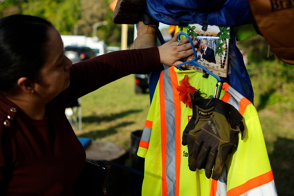 BALTIMORE, MARYLAND - APRIL 26: Fatima Ramires of Brooklyn Park, Maryland, touches a photograph of her brother-in-law Jose Lopez, one of the six men killed on the collapse of the Francis Scott Key Bridge, during a vigil on April 26, 2024 in Baltimore, Maryland. Six men were repairing potholes on the Key Bridge when the cargo ship Dali struck the bridge and caused it to collapse one month ago on March 26.