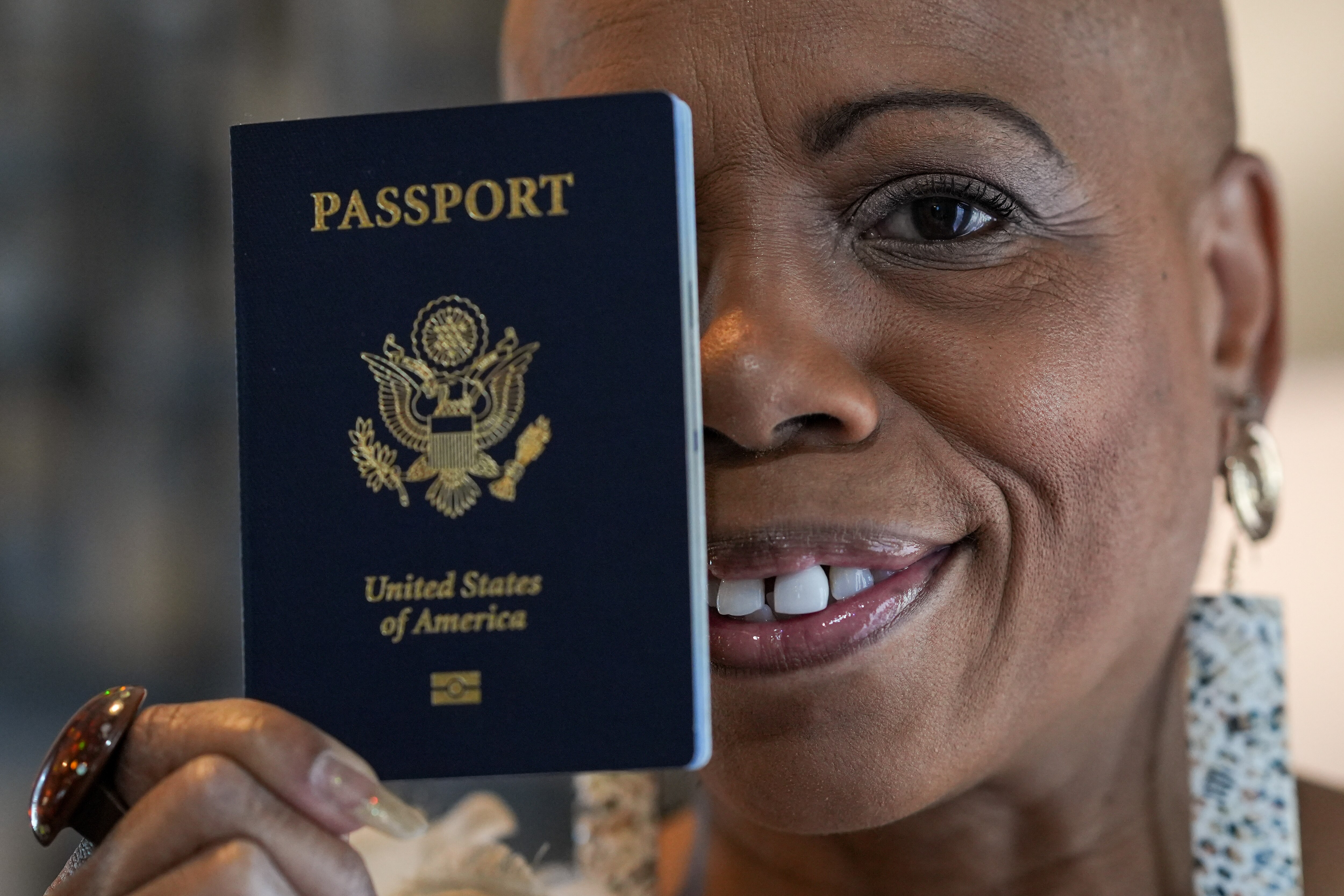 Simboli Ruffin, holding her passport, stands for a portrait in her home on Tuesday, June 13, 2023. Ruffin, the Baltimore woman known as 'the longest living Jane Doe,' finally discovered her true identity in 2022 following a decades-long search and a Baltimore Banner investigation.