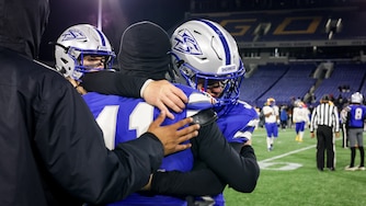 Sherwood players console each other after losing to the Mergenthaler Mustangs at Thursday’s Maryland State Football Championships at the Navy-Marine Corps Memorial Stadium in Annapolis.