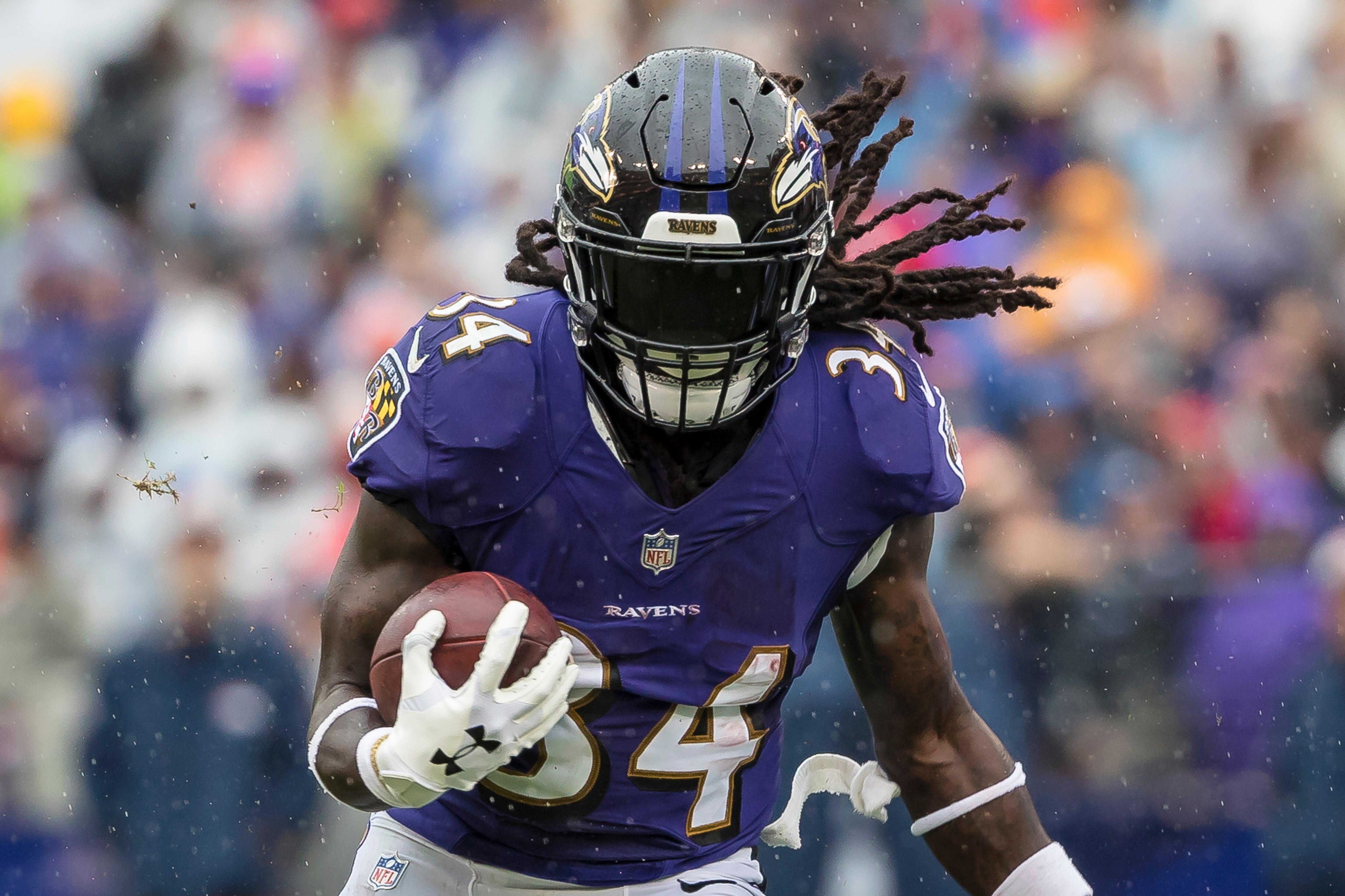 Alex Collins #34 of the Baltimore Ravens rushes against the Denver Broncos during the first half at M&T Bank Stadium on September 23, 2018 in Baltimore, Maryland.