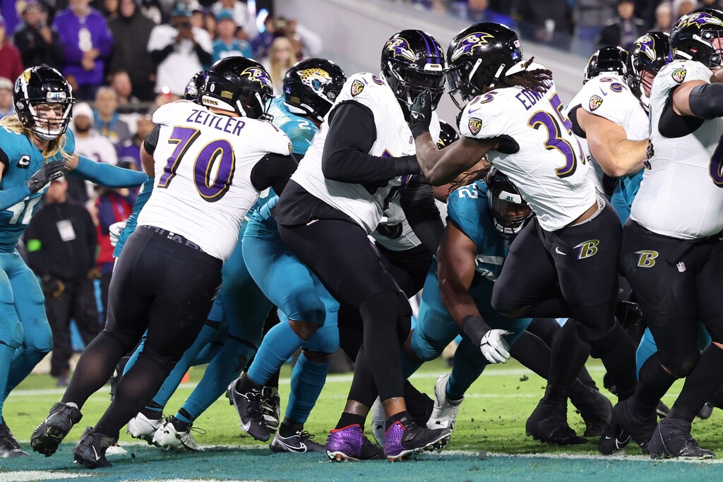 JACKSONVILLE, FLORIDA - DECEMBER 17: Gus Edwards #35 of the Baltimore Ravens scores a rushing touchdown against the Jacksonville Jaguars during the fourth quarter at EverBank Stadium on December 17, 2023 in Jacksonville, Florida. (Photo by Mike Carlson/Getty Images)