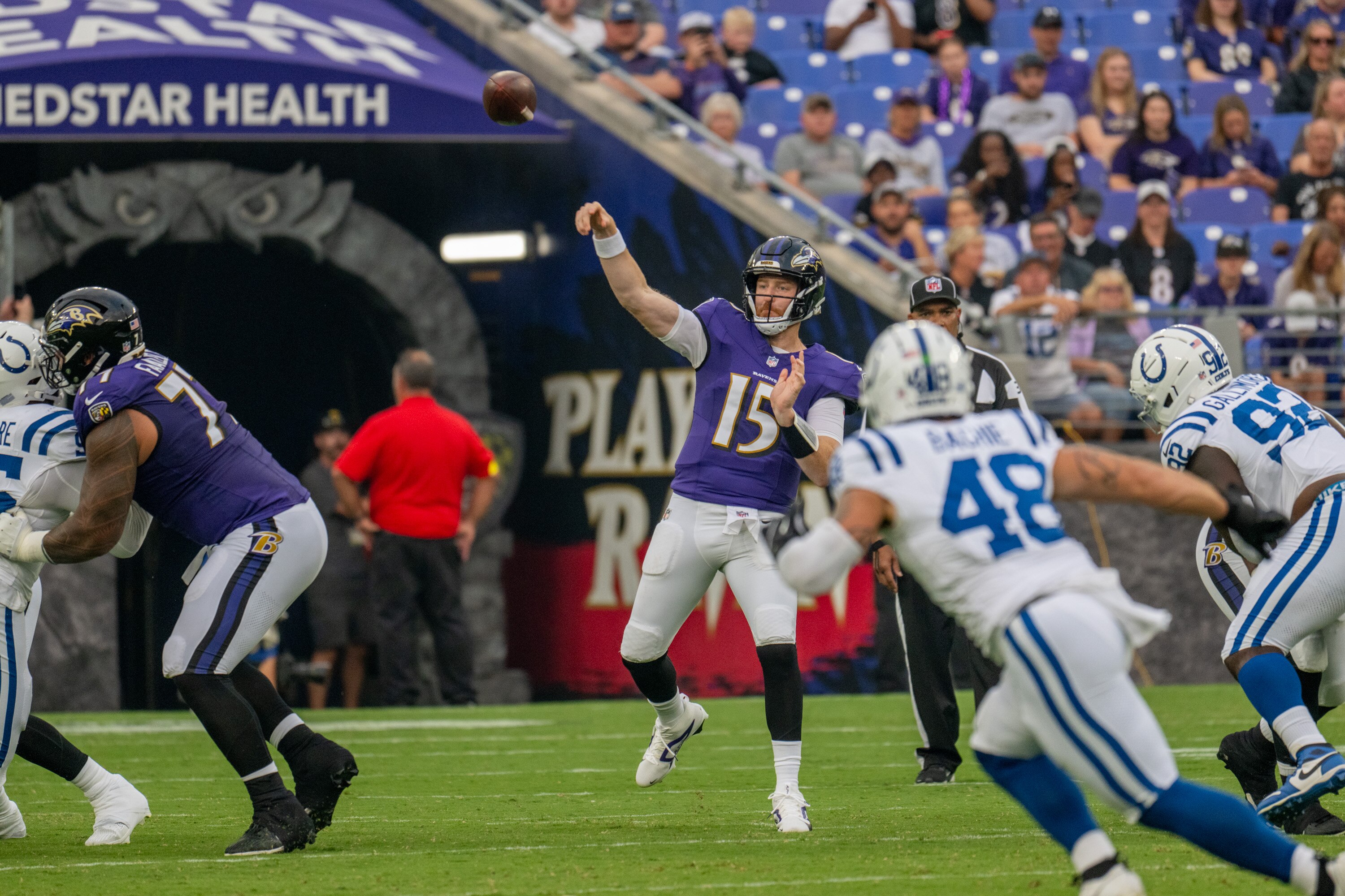 Thursday, Aug. 7, 2025 — Baltimore Ravens quarterback Cooper Rush (15) throws downfield during the first quarter against the Indianapolis Colts.