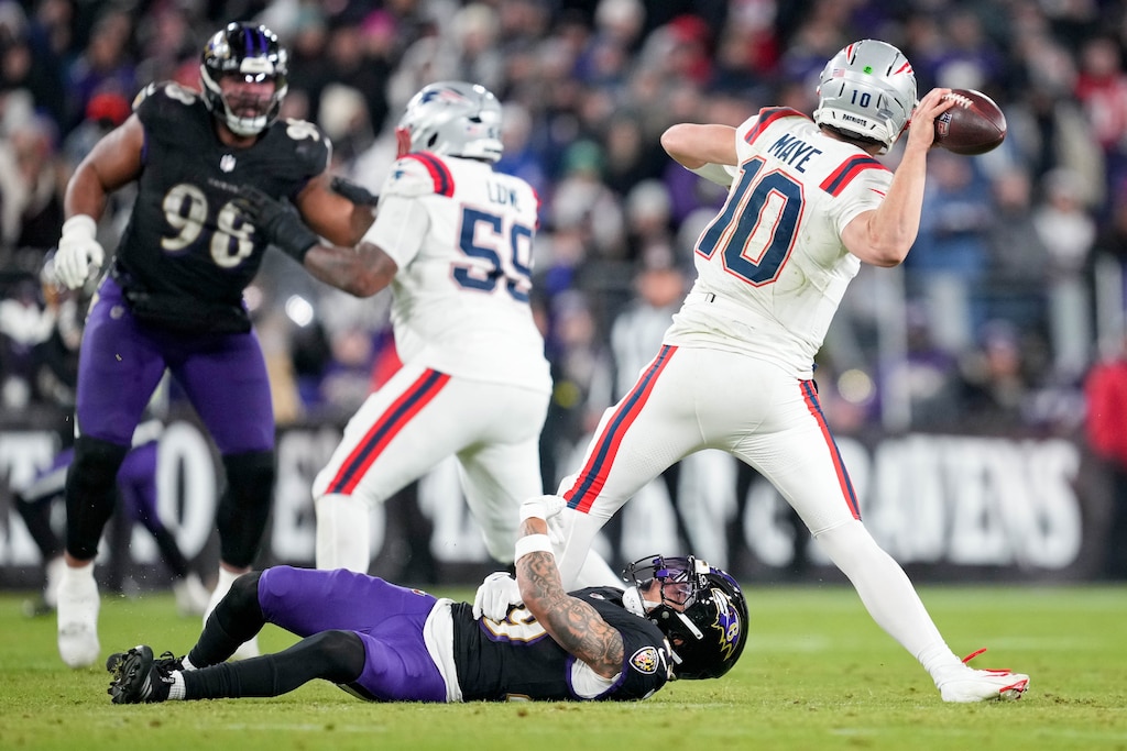 Baltimore Ravens safety Ar'Darius Washington (29) pressures New England Patriots quarterback Drake Maye (10) in the third quarter of a football game at M&T Bank Stadium in Baltimore, Md. on Sunday, December 21, 2025. The Sunday Night Football game was the Ravens’ final home game of the regular season.