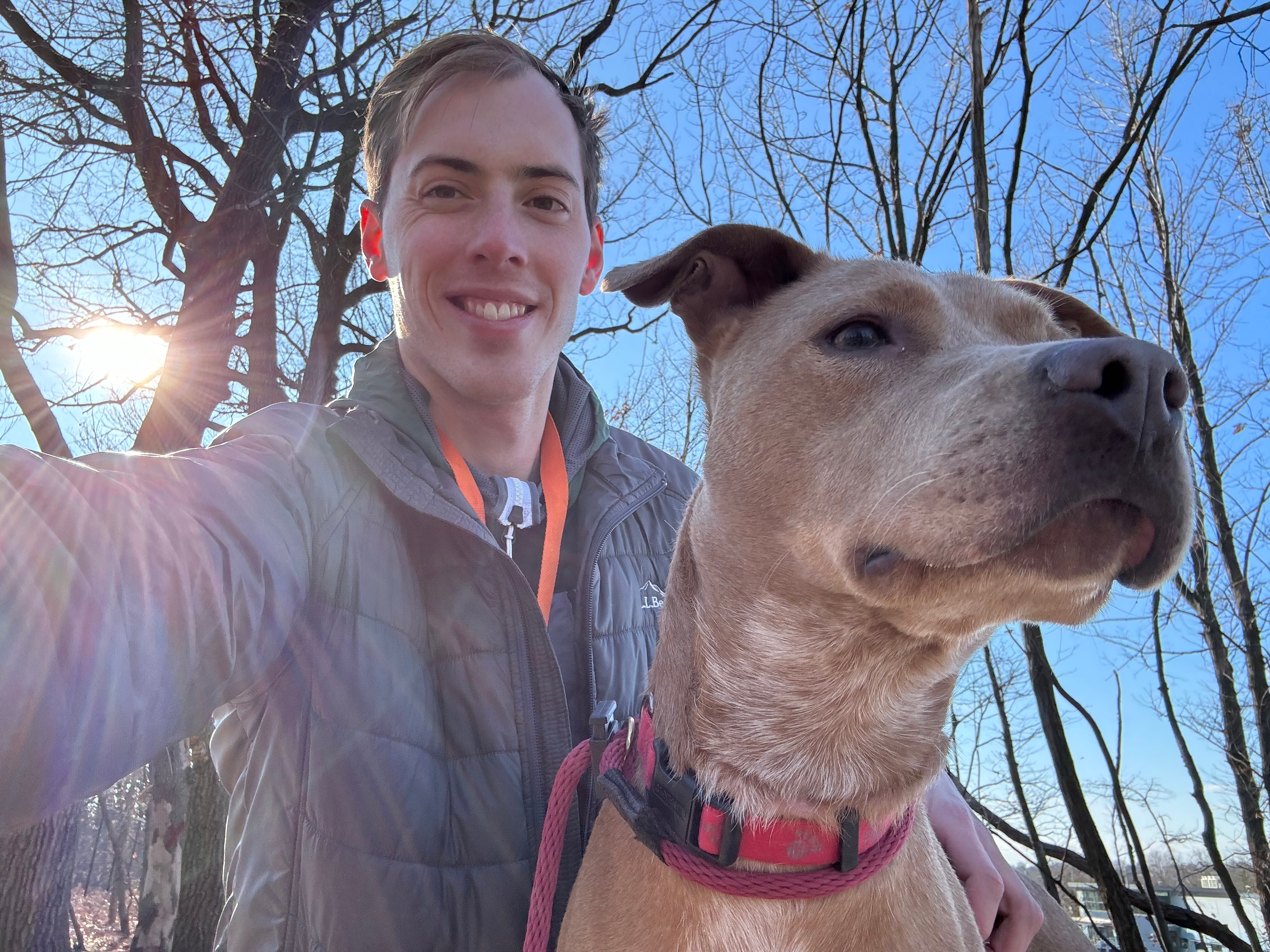 Andy Kostka takes a selfie with Jumping Bean, a dog at BARCS.