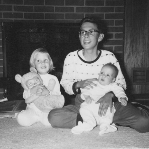 Lee Hudson with his siblings shortly after the birth of his youngest brother; Lee was like another parent/caretaker to his younger siblings. L-R, Donna Hudson, Lee Hudson and David Hudson.