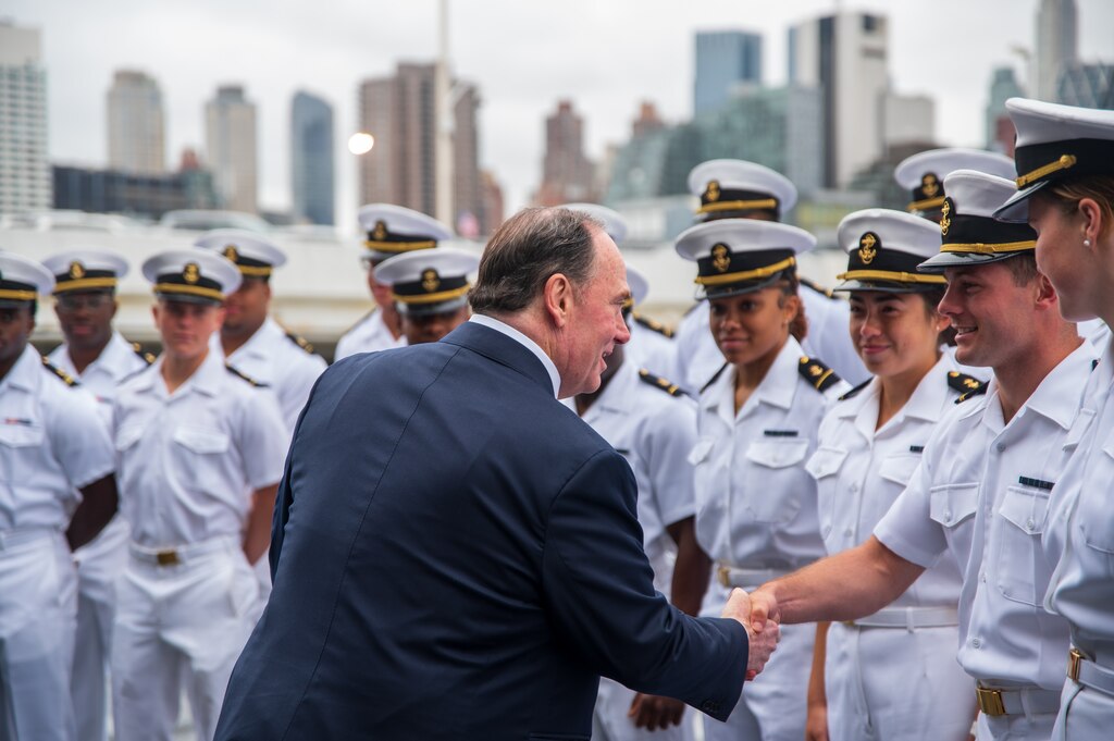 Secretary of the Navy John Phelan greets Naval Academy midshipmen during a tour of the USS New York during Fleet Week New York in May.