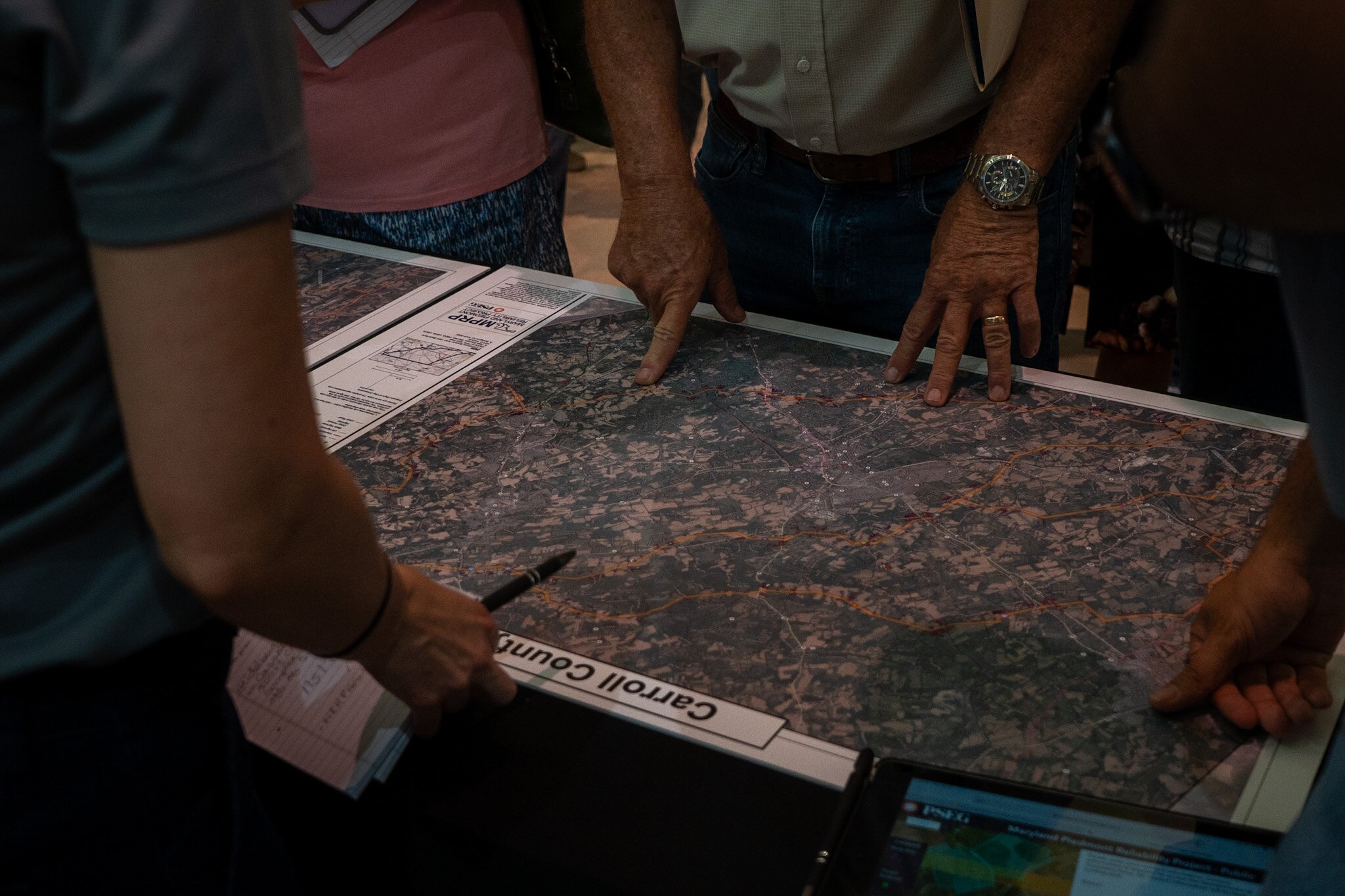 Maps displaying the plans for future electrical grid enhancements at an earlier public information session held by the Maryland Piedmont Reliability Project in Westminster. The company planning to build the transmission line held a meeting in Baltimore County last night and is holding another in Westminster tonight.