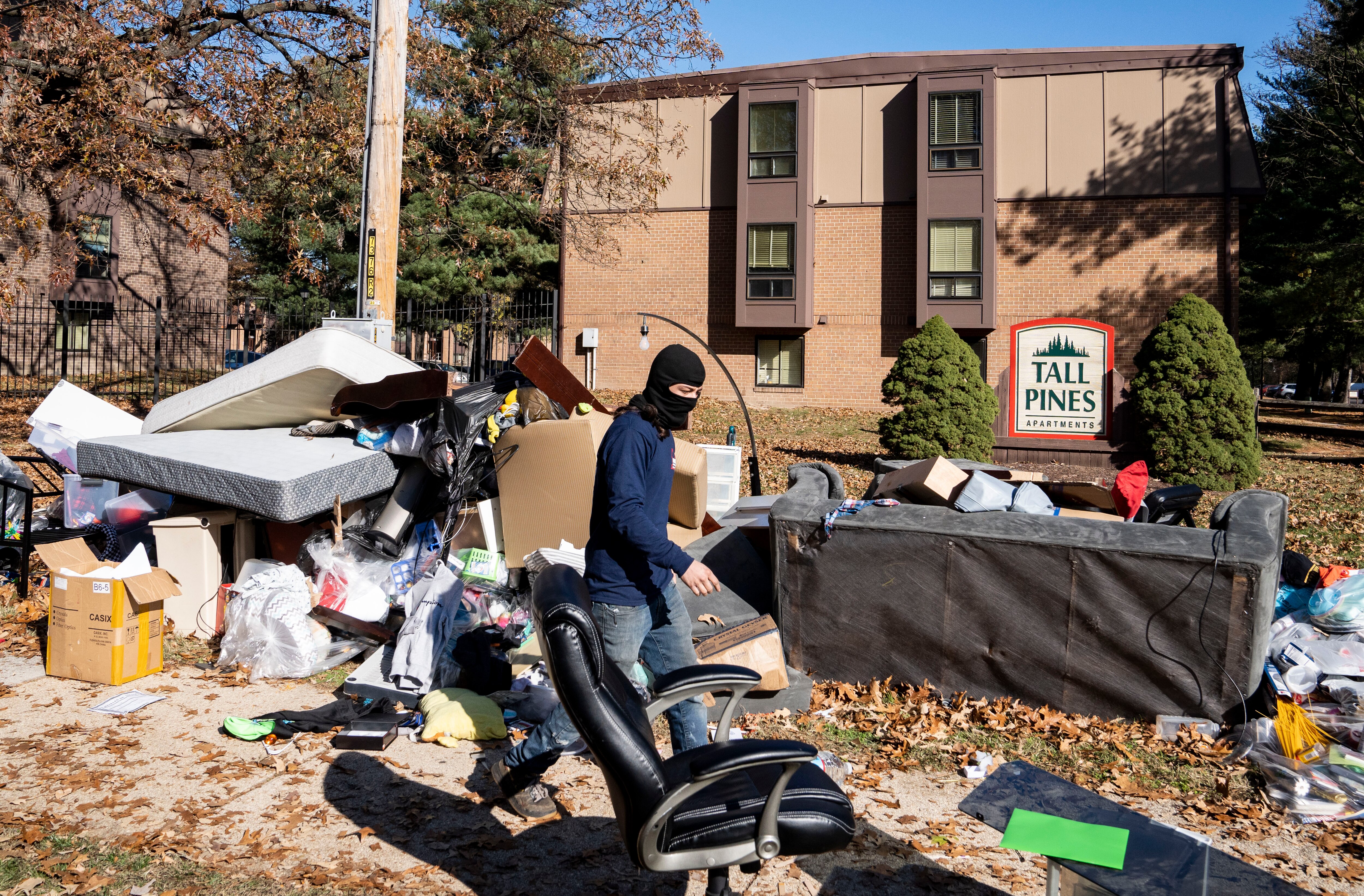 Movers collect the belongings of Sharnae Hunt, and place back onto a truck after Hunt was wrongfully evicted, at Tall Pines apartment, in Glen Burnie, Tuesday, November 22, 2022.