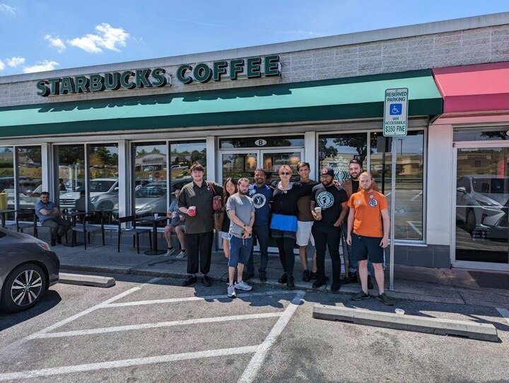 Workers and supporters stand in front of an Ellicott City Starbucks during a community event to show support for unionizing efforts. (Courtesy of Gordon Mutch)