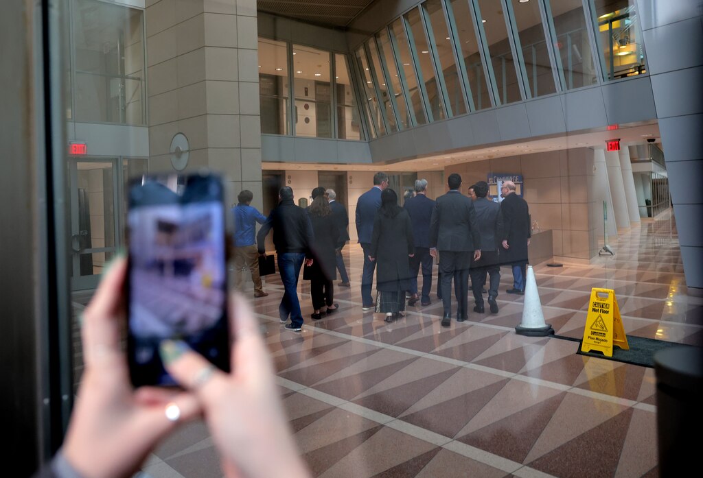 WASHINGTON, DC - FEBRUARY 03: Lawmakers, including U.S. Sen. Chris Van Hollen (D., Md.), Rep. Don Beyer (D., Va.), Sen. Brian Schatz (D., Hawaii) and others walk in the lobby of the U.S. Agency for International Development (USAID) headquarters after holding a press conference on USAID being shutdown, on February 3, 2025 in Washington, D.C. Elon Musk, tech billionaire and head of the Department of Government Efficiency (DOGE), said in a social media post that he and U.S. President Donald Trump will shut down the foreign assistance agency.