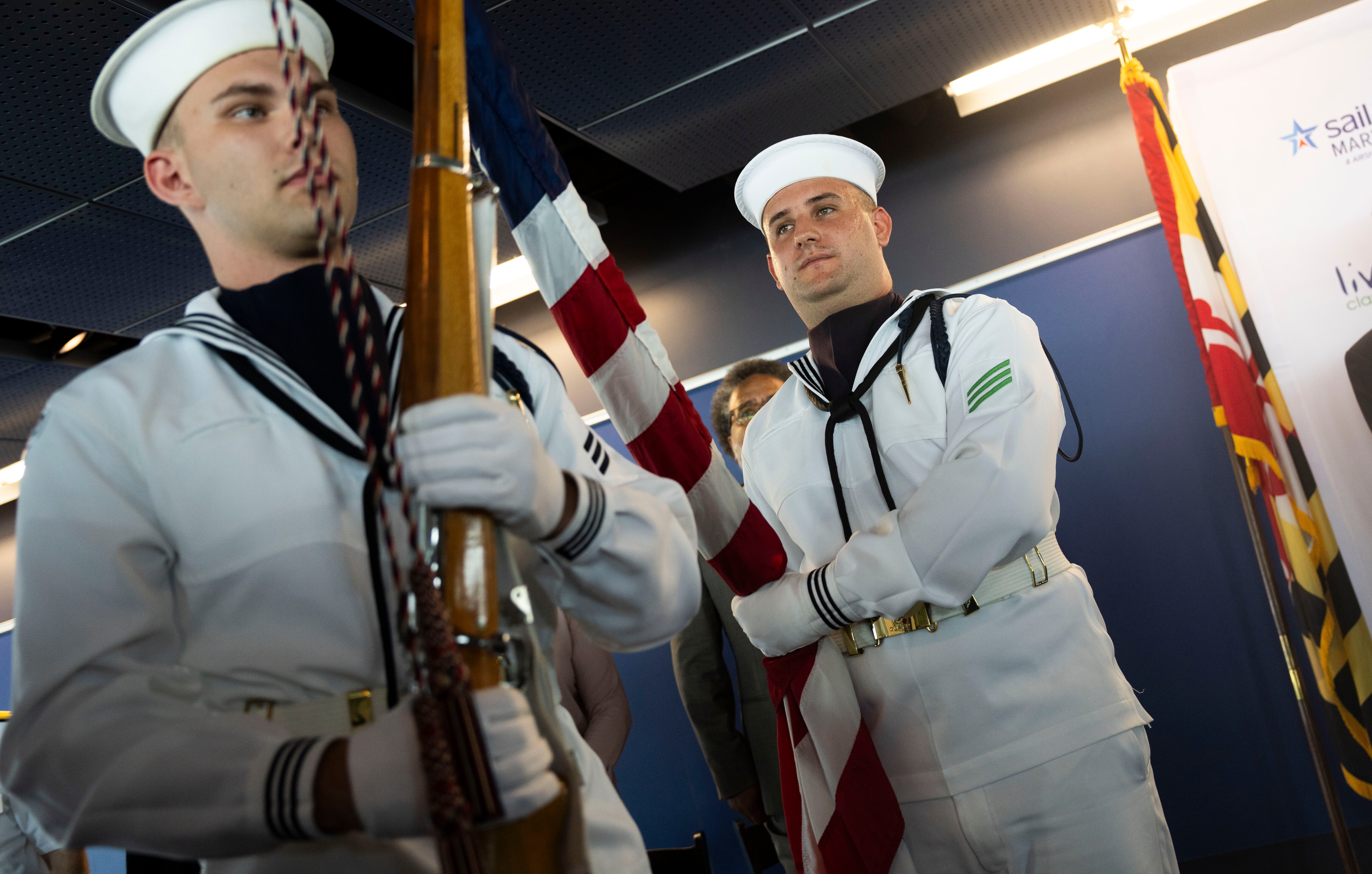 Members of the U.S. Navy perform flag duties during a press conference to announce Sail250, a celebration of America’s 250th birthday, on Tuesday.