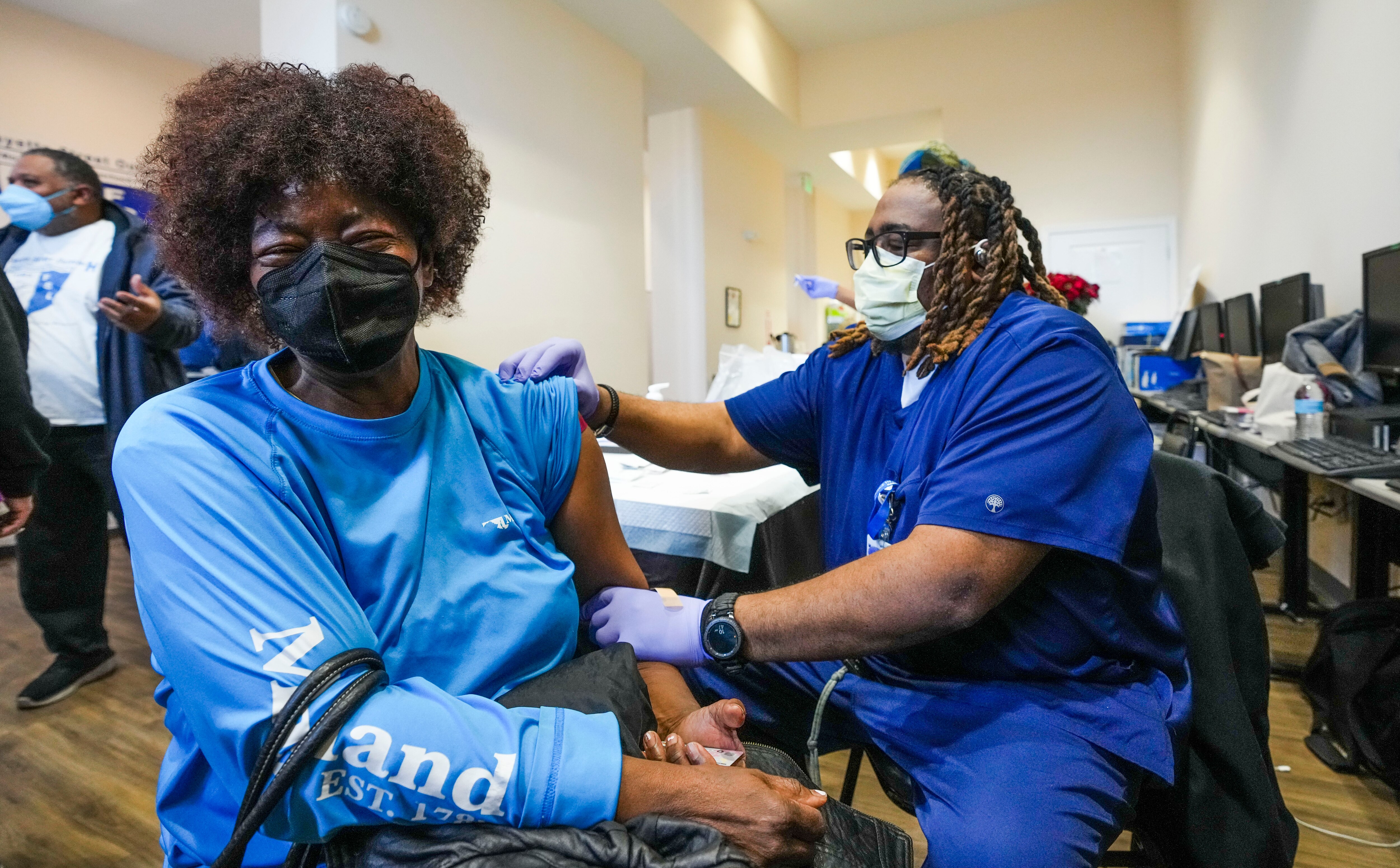 Geraldine Long, a neighborhood resident, comes in to get her COVID booster. Baltimore City's continued effort towards combating COVID-19 includes a stationary mobile clinic that gives vaccine recievers incentives to keep up to date on their vaccines.  A mobile setup is shown here on February 10, 2023.