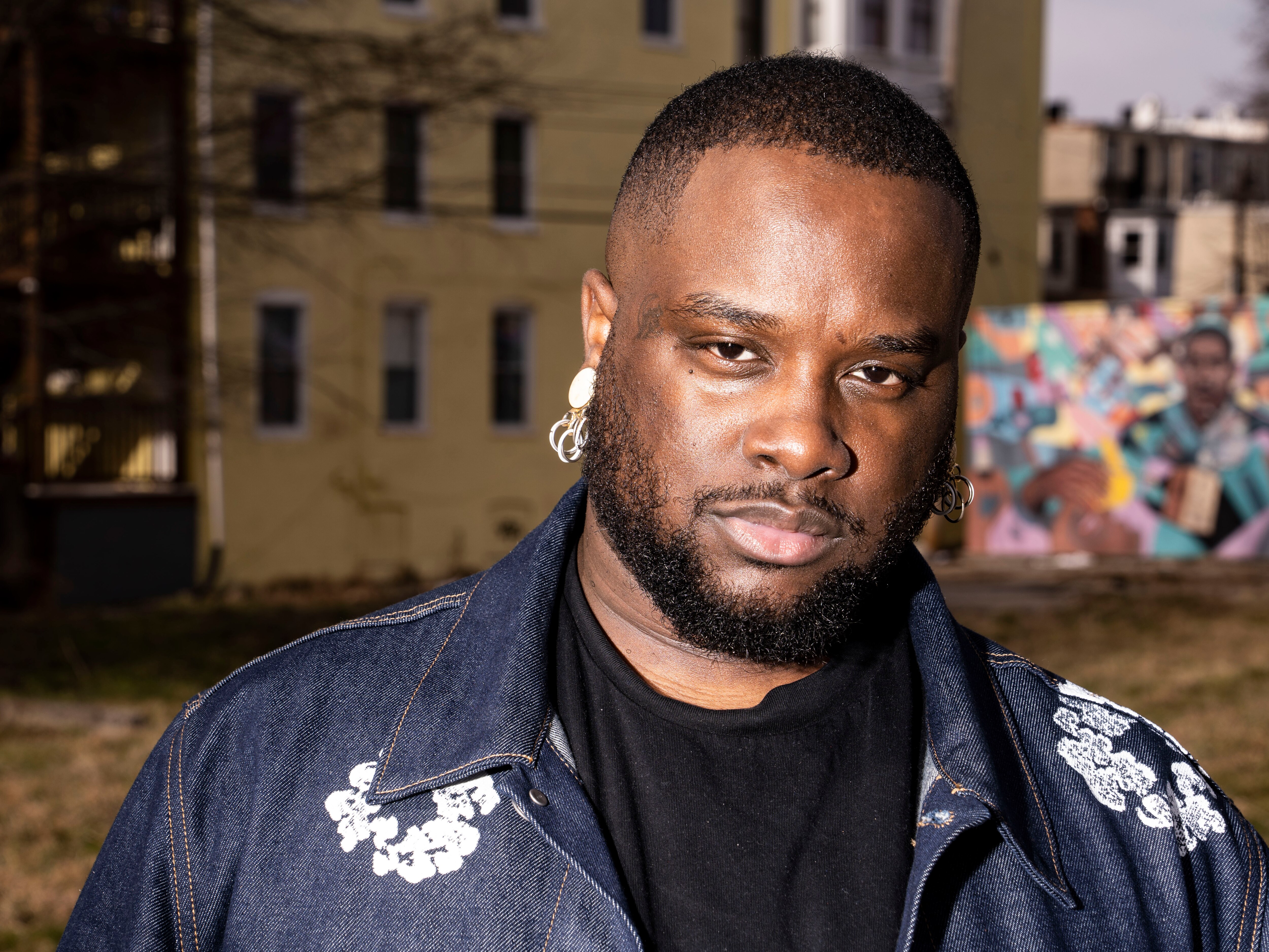 Abdu Ali poses for a portrait in their neighborhood, in Baltimore, Monday, February 13, 2023. 