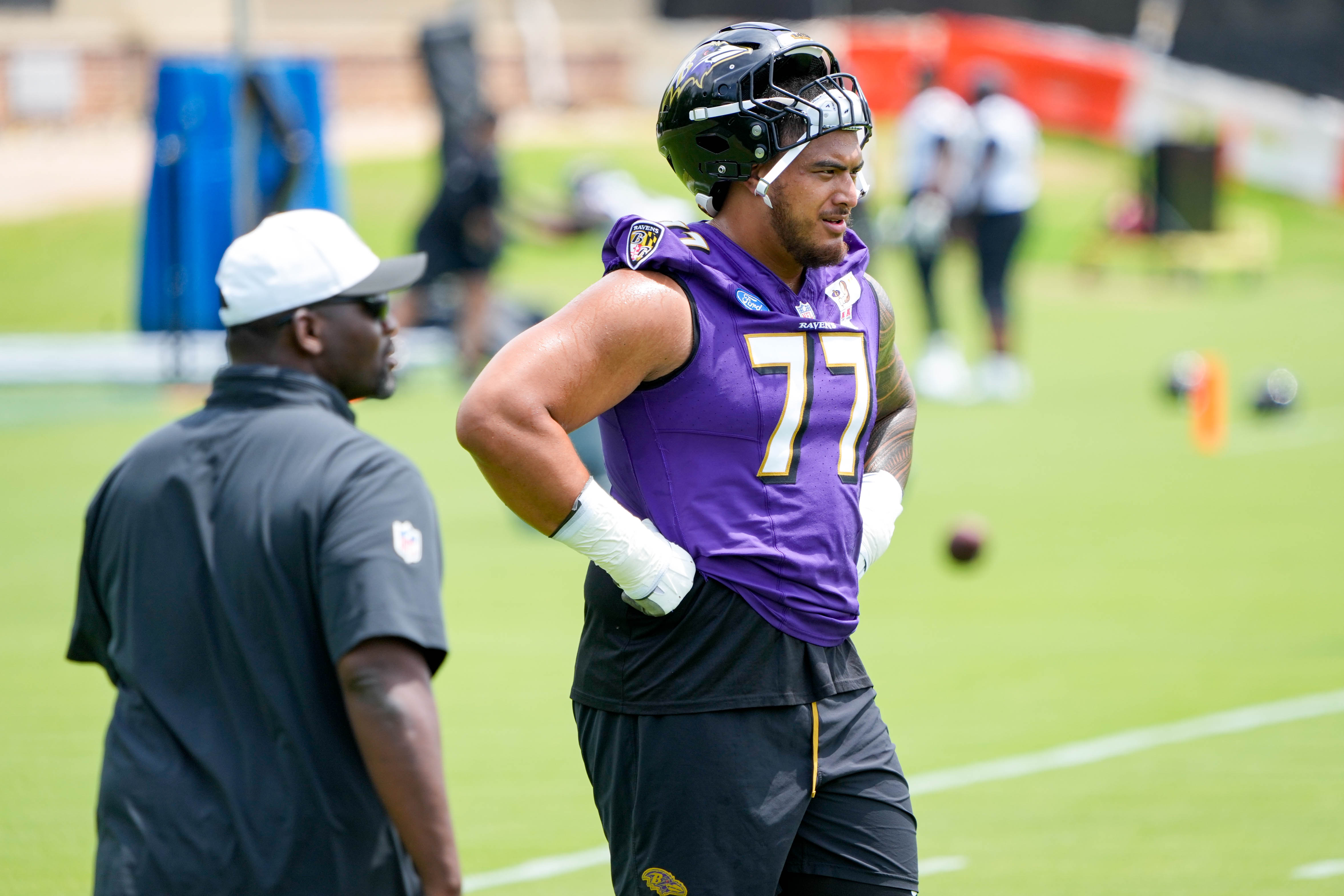 Guard Daniel Faalele (77) waits for instructions during the Ravens’ organized team activities on June 10.