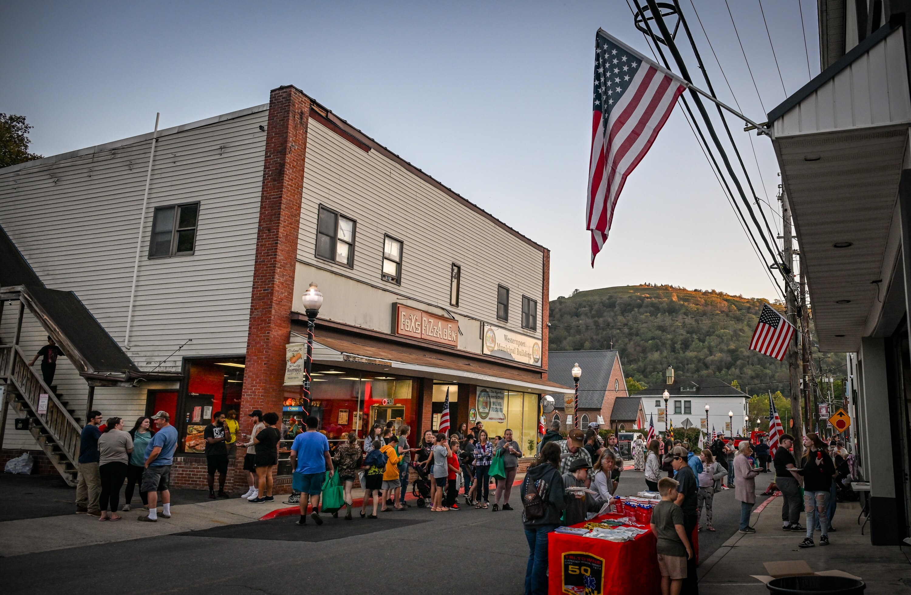 Westernport residents fill Main Street for pizza and funnel cakes as the town holds a block party celebrating its recovery from the massive flooding in May.