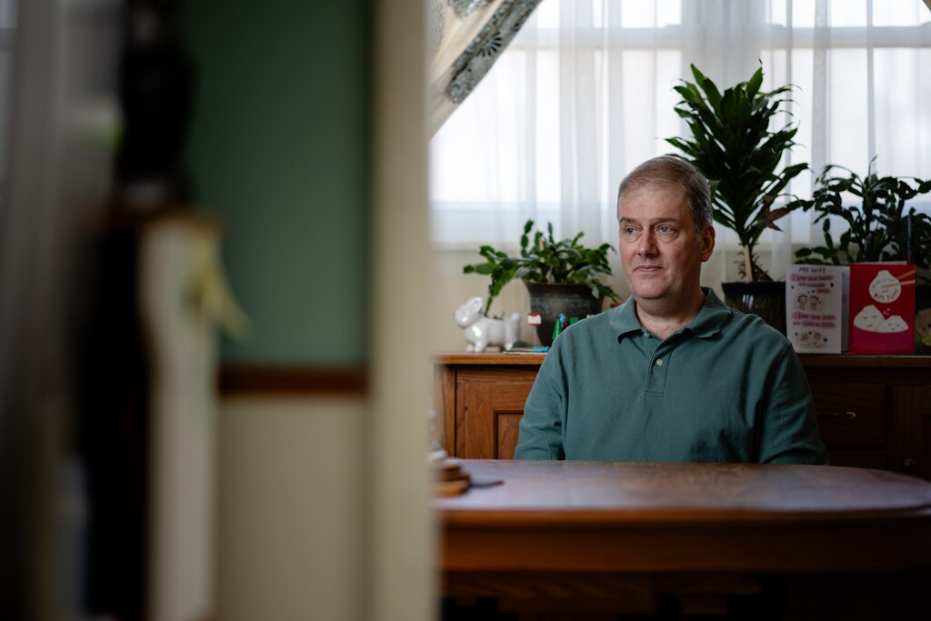 John Tilden, retired Senior Technical Specialist for the Social Security Administration, poses for a portrait in his home on February 18th, 2025 in Millersville, MD.