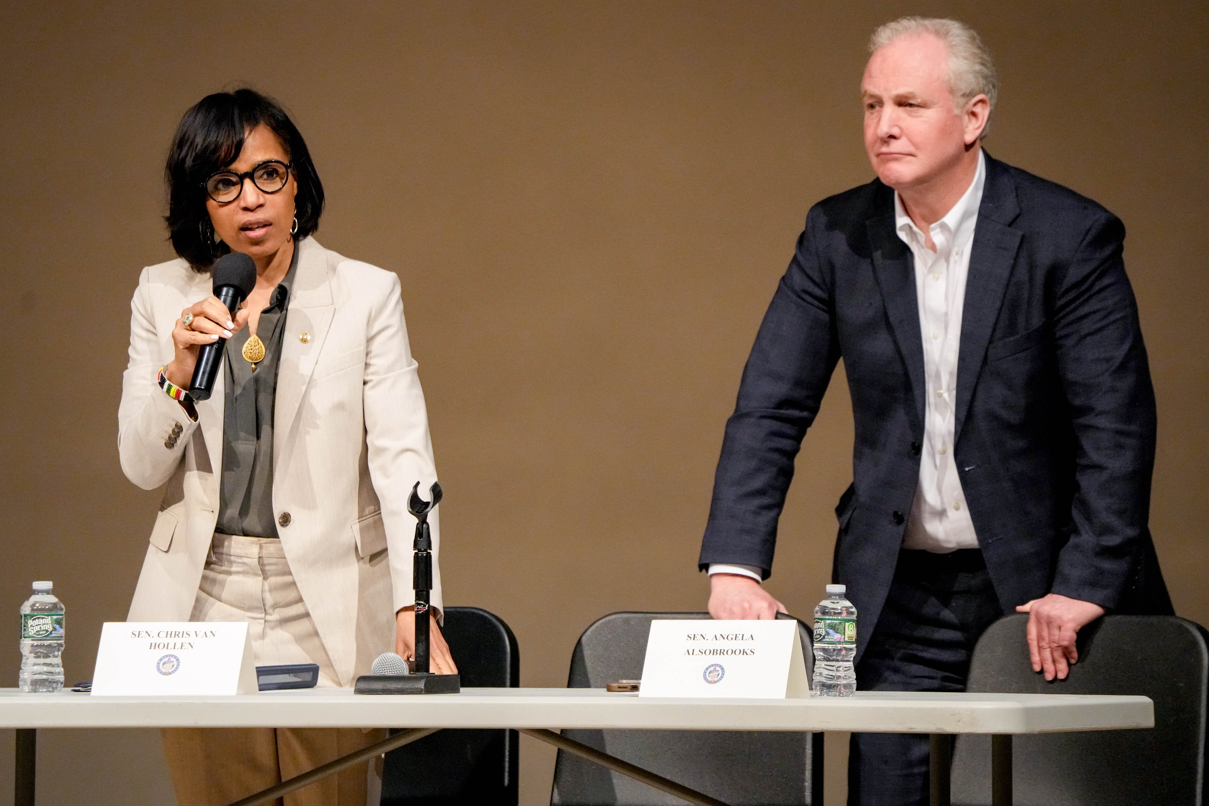 U.S. Sens. Angela Alsobrooks, left, and Chris Van Hollen at a town hall meeting in Woodlawn earlier this year.