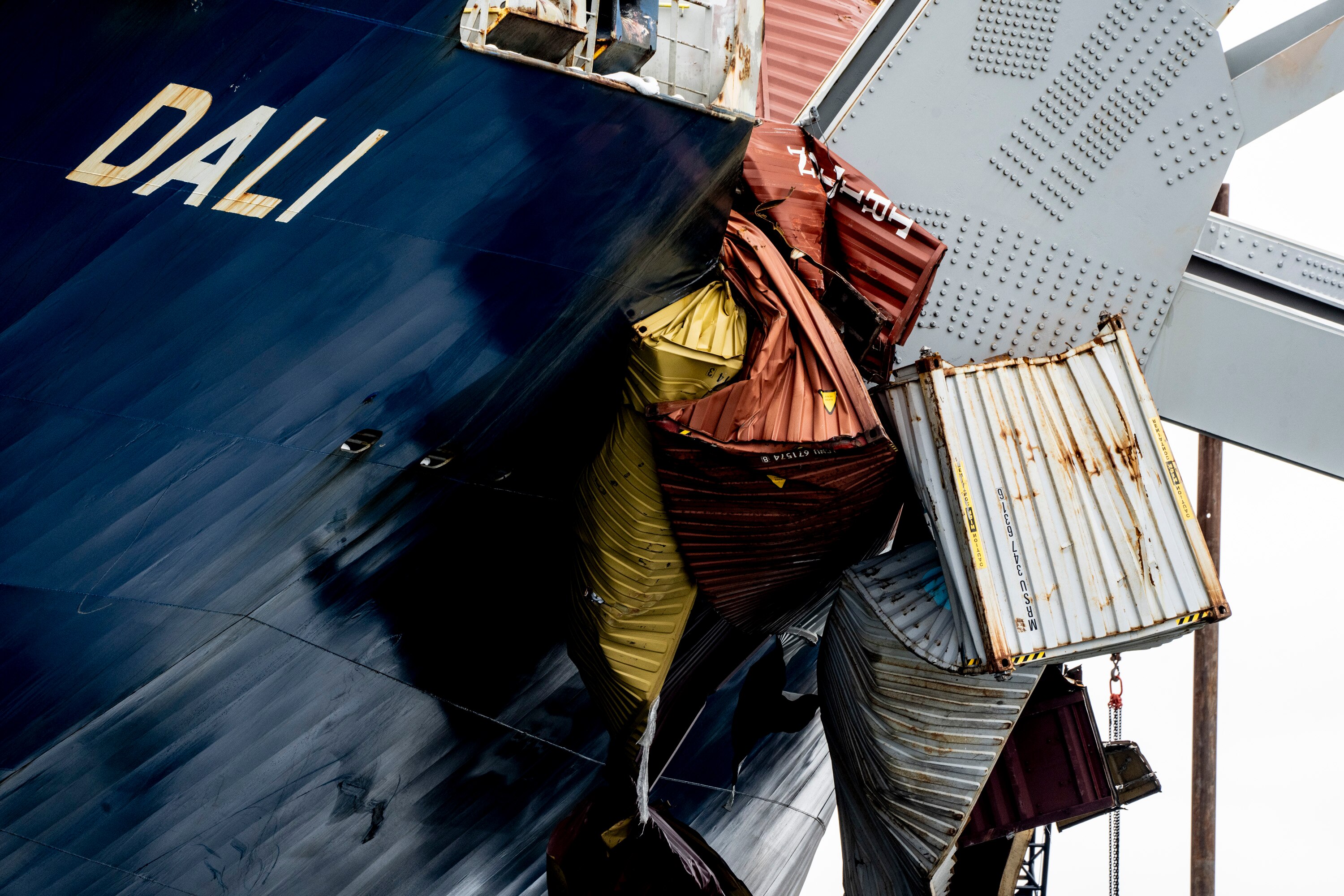 The massive cargo ship Dali remains under wreckage of the collapsed Francis Scott Key Bridge on April 1.