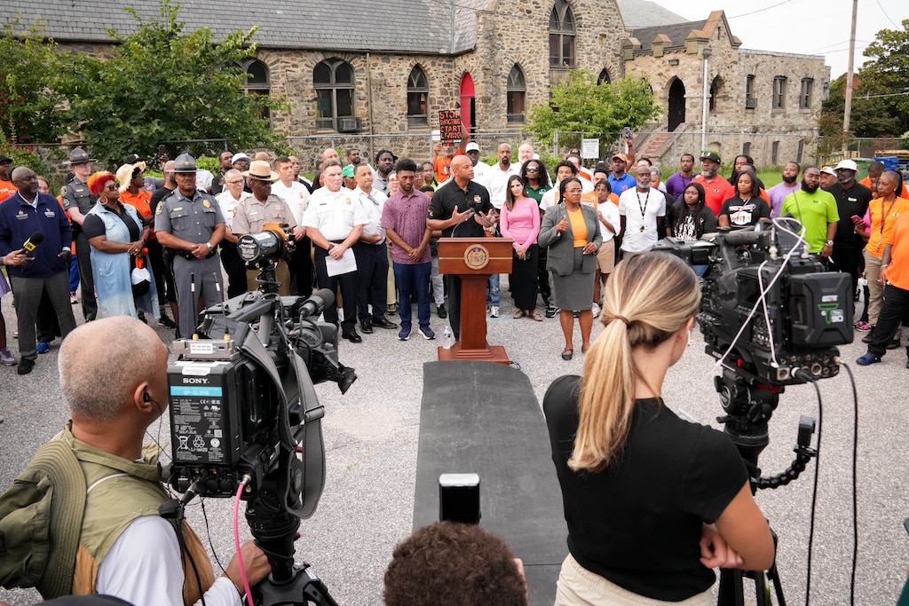 Maryland Gov. Wes Moore, accompanied by Baltimore Mayor Brandon Scott, law enforcement and elected officials, gives remarks following their Community Walk in northwest Baltimore, Md., on Friday, Sept. 5, 2025.