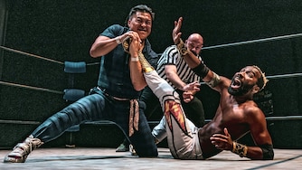 Filipinot Grigio, left, tries to submit “The World Famous” Cheeseburger at Flying V Theatre's "Double Dash II" on May 31, 2025. The two will appear at the nonprofit's "Fighter Fantasy" on Dec. 20 at Silver Spring Black Box Theatre.