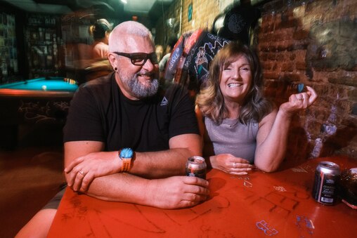 Long time Metal Mondayers, Ryan and Wendy Phillips, recount stories about their connection to the metal music Ozzy pioneered during Metal Monday at Ottobar in Baltimore on Monday, July 28, 2025.