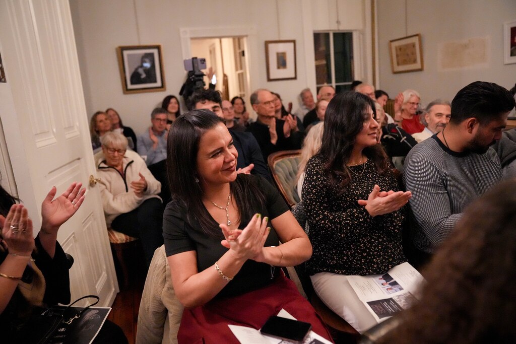 Katya Cordero and other attendees applaud as the Joshua Espinoza Trio performs during a Union Square Soirée in Baltimore, Md. on Friday, January 31, 2025. For a year now, a neighbor in Union Square has hosted intimate music concerts in his historic home’s salon to serve as a platform for newer artists and to share music with the community.