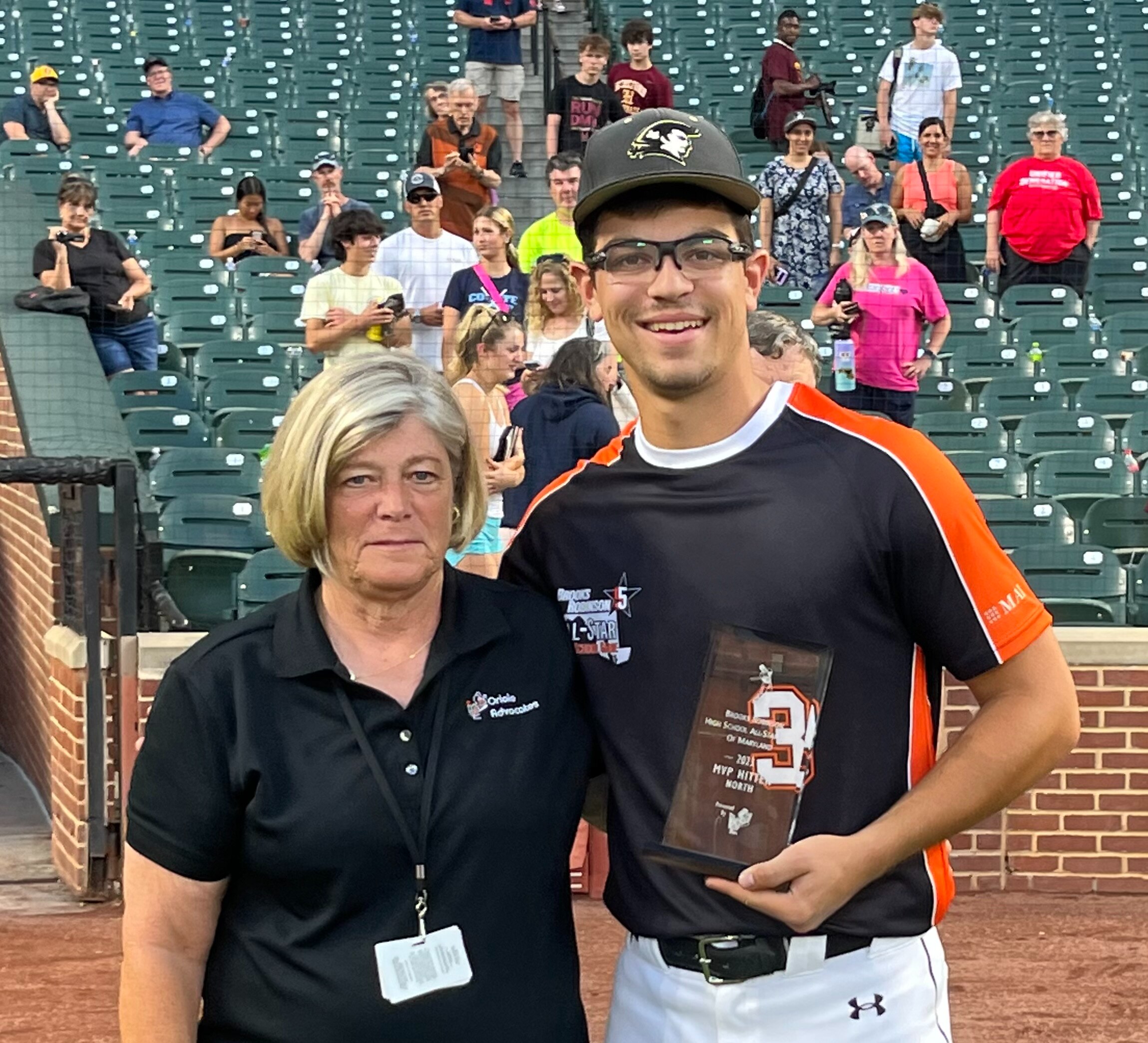 Frank Adamski (right), pictured with Paula Kunaniec of the Oriole Advocates, was the Most Valuable Player for the North team at Sunday's Brooks Robinson Senior All-Star Baseball Game at Oriole Park at Camden Yards Sunday evening. The recent John Carroll graduate had two hits including a 2-run triple in the first inning as the North defeated the South, 5-3.