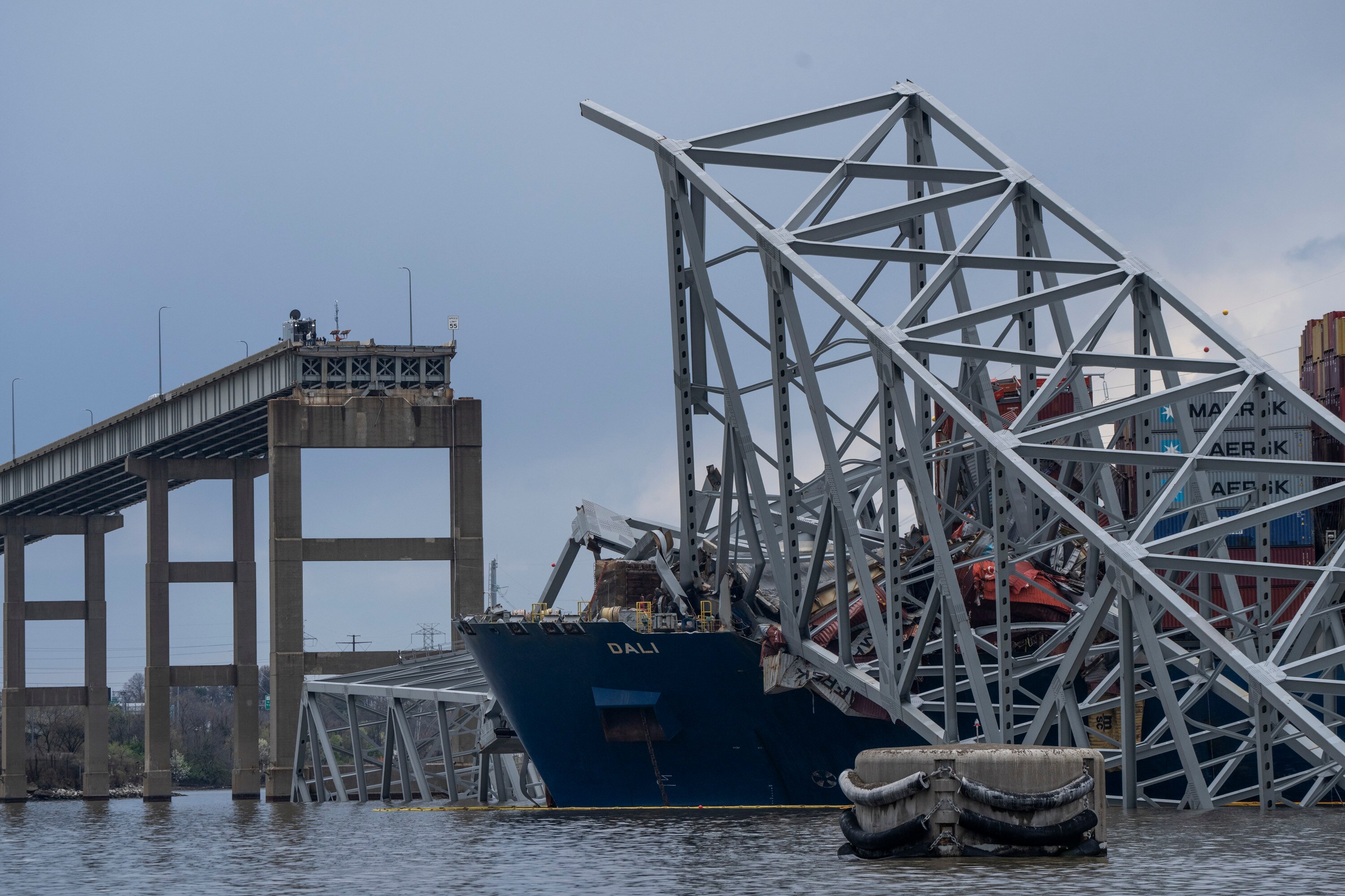 The site of the collapsed Francis Scott Key Bridge and the Dali, seen from a debris retrieval vessel in April 2024.